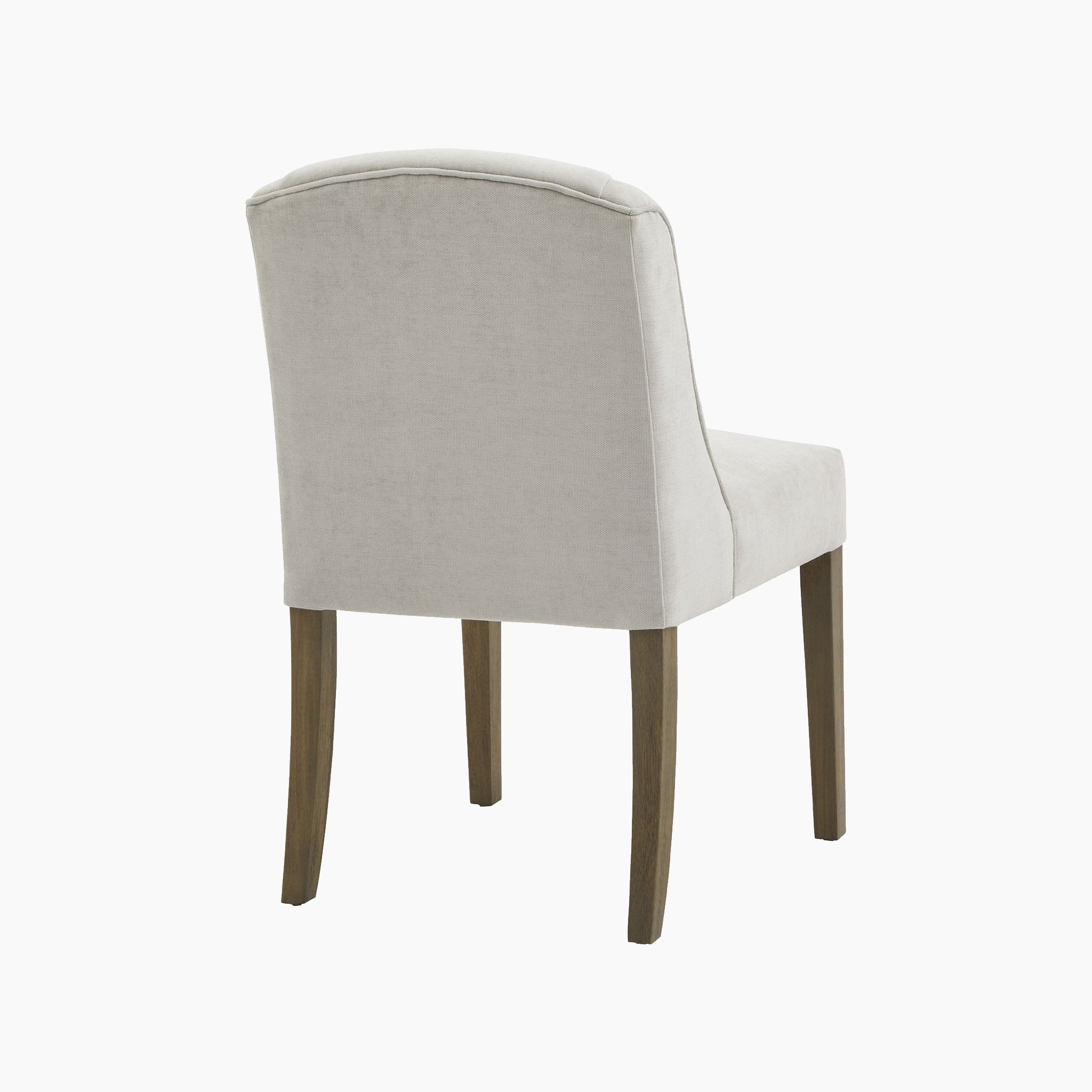 Rear view of the Kingham Grey Dining Chair, featuring a cream-colored upholstered seat with wooden legs made from elegant rubberwood, set against a white background.