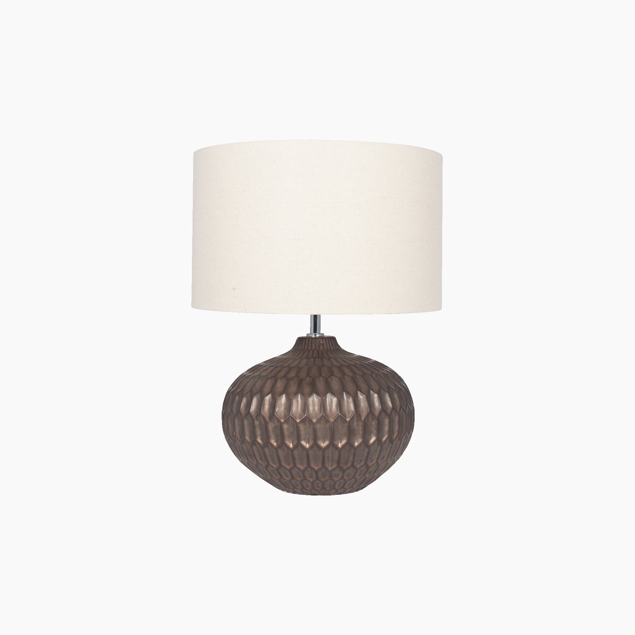 The Cassius Bronze Textured Glazed Ceramic Table Lamp boasts a textured design with a durable ceramic base and is complemented by a beige linen-look drum shade, all showcased against a white background.