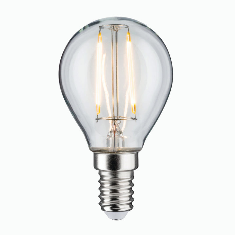 Paulmann's Filament LED Drop Bulb, featuring a clear glass drop shape with visible filaments and a metallic E14 screw base, emits a warm white light. Its design offers an eye-friendly glow that is perfect for any space, all set against a simple white background.