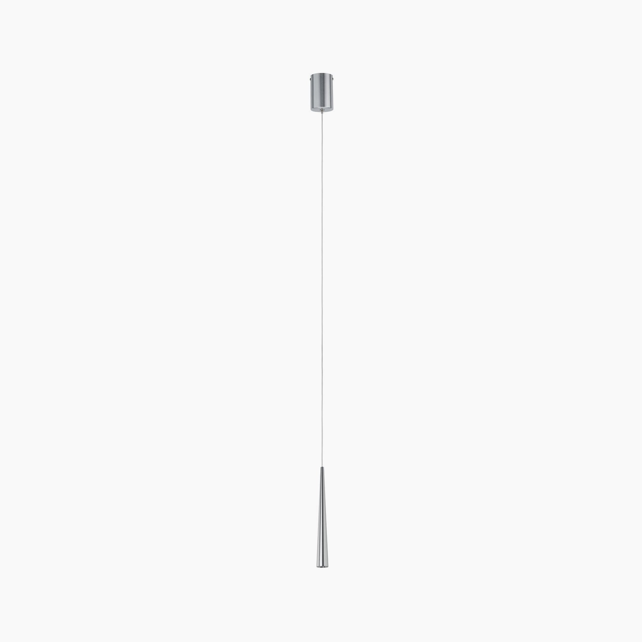 The Gutta 8.5W LED Dimmable 1 Lamp Pendant Light in Brushed Aluminium is a sleek, modern pendant featuring a thin, elongated silver cone shape that delivers a focused lighting effect. It hangs elegantly from the ceiling on an adjustable fabric cable, adding both style and functionality to any space.