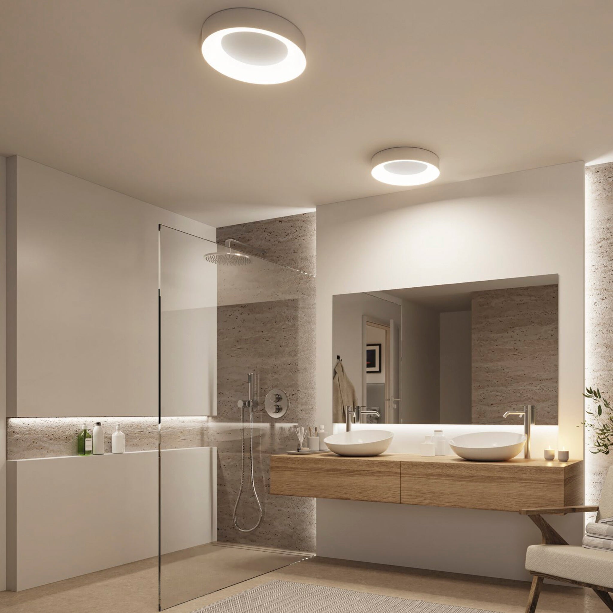 Modern bathroom with glass shower, wooden vanity with double sinks, large mirror, and a Casca 25W LED Switch 2100lm Ceiling Light in Matt Aluminium that adjusts the light colour.