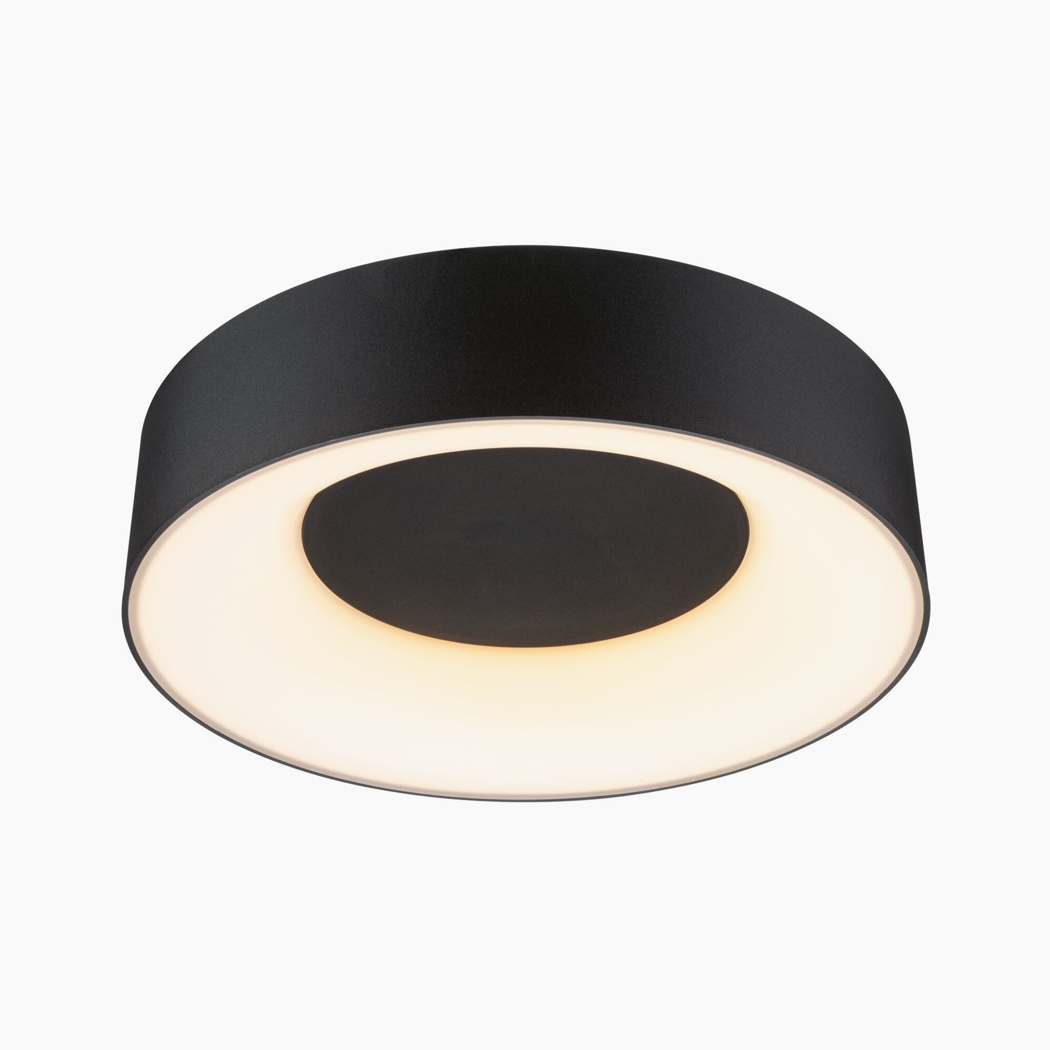 A circular Casca 18W LED Switch 1500lm ceiling light in black matt, with a central light illuminating a warm glow, offering a special lighting effect.