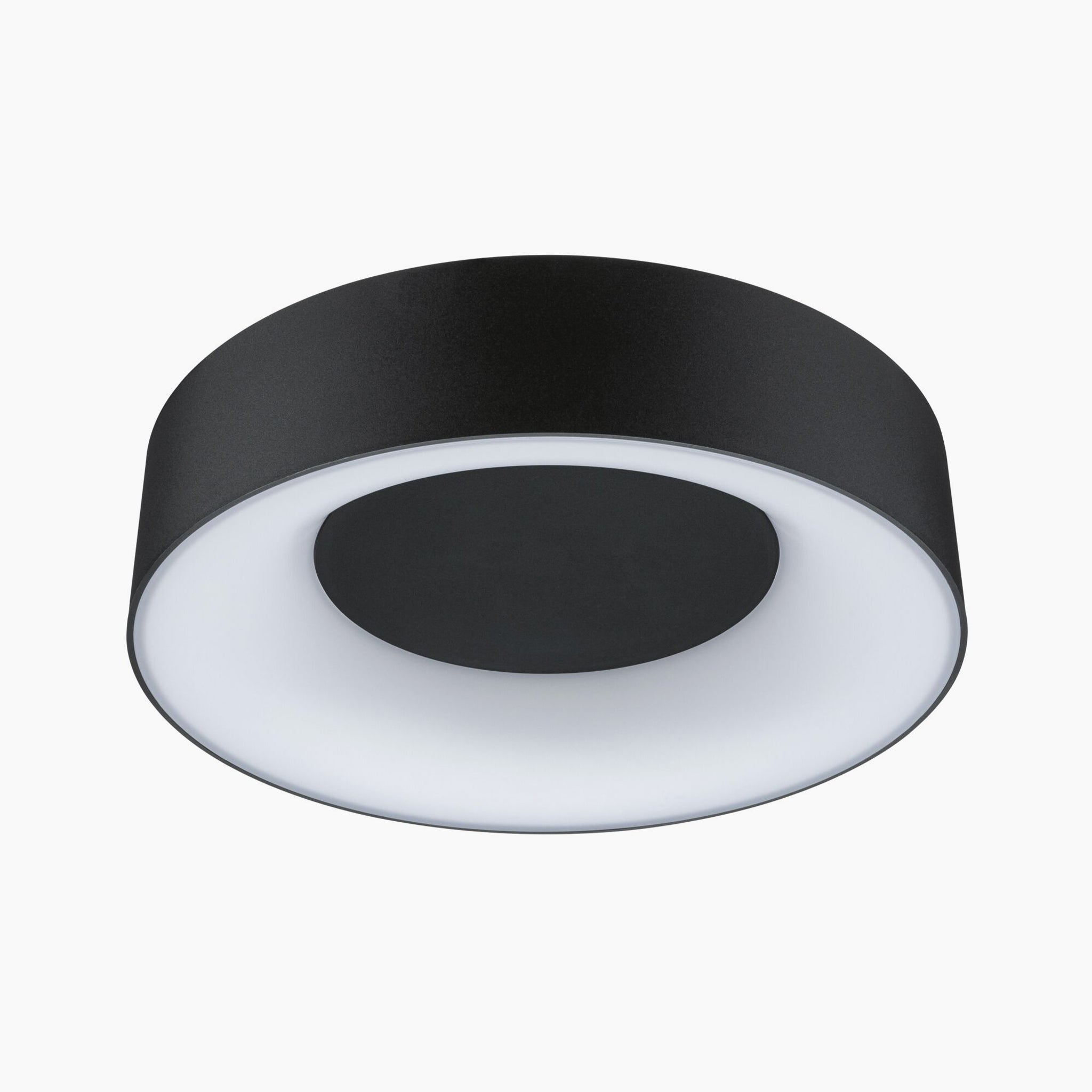 The Casca 18W LED Switch 1500lm Ceiling Light in Black Matt, with its circular design featuring a white inner ring and a black center, delivers a special lighting effect.