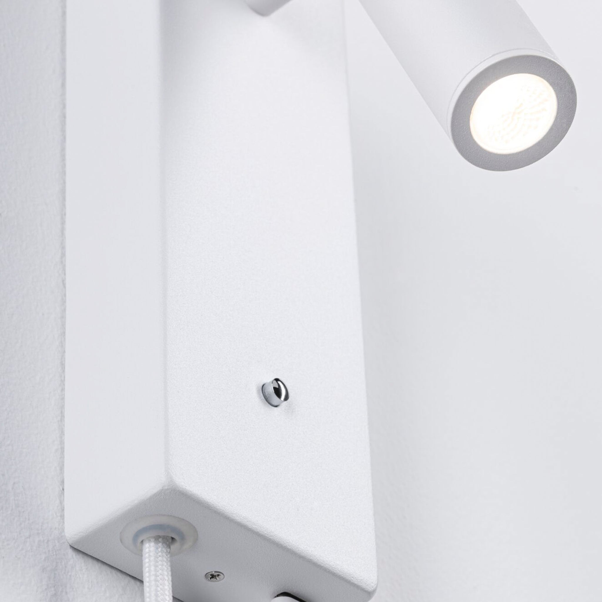 Featuring a minimalist design, the Paulmann Hulda 14W LED Wall Light in white matt includes a cylindrical fixture, a flexible luminaire head, and a convenient cord switch.