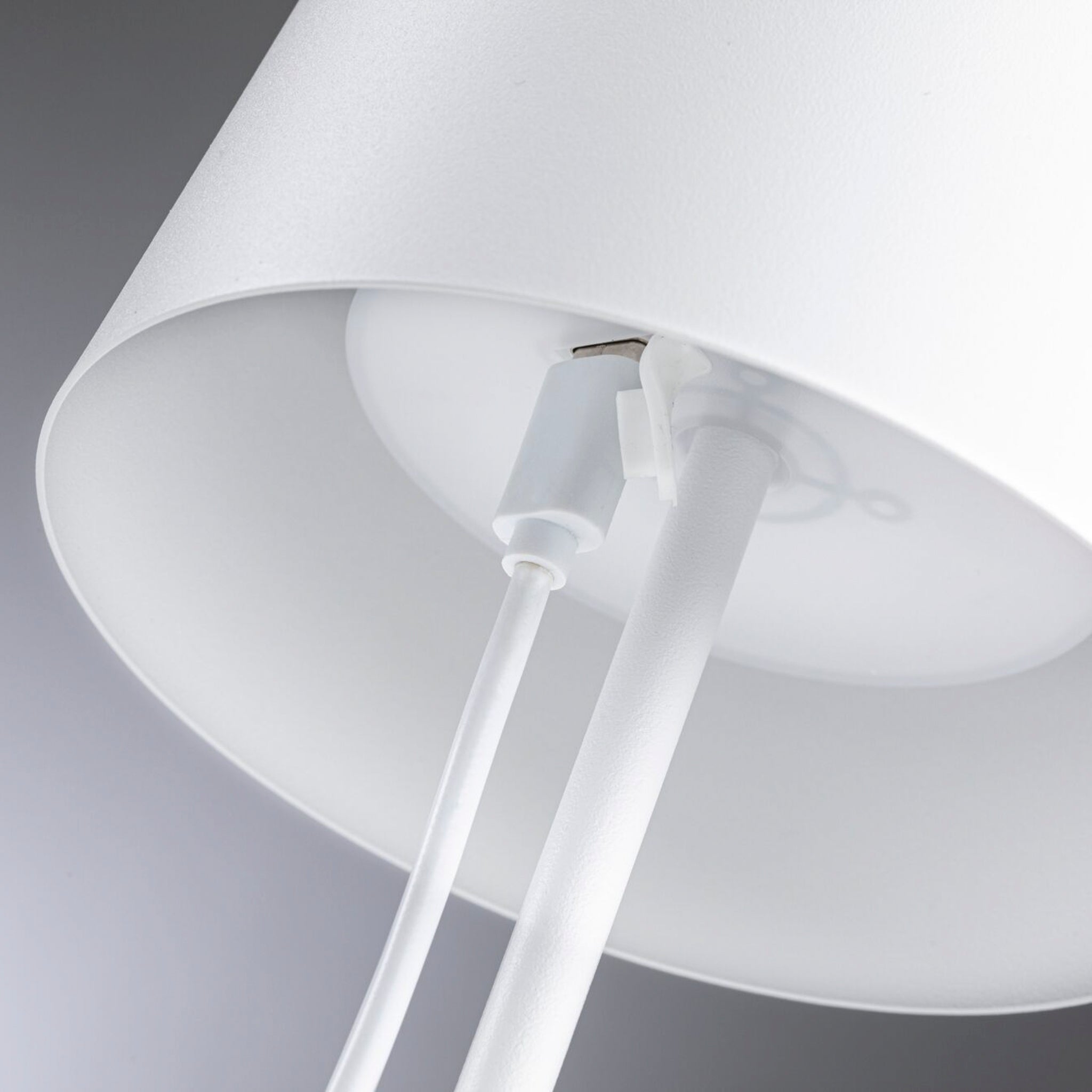 Close-up view of a Gilo 2.8W LED Mobile Dimmable Floor Lamp in White Matt, highlighting the interior connection point of its attached cord and white lampshade.