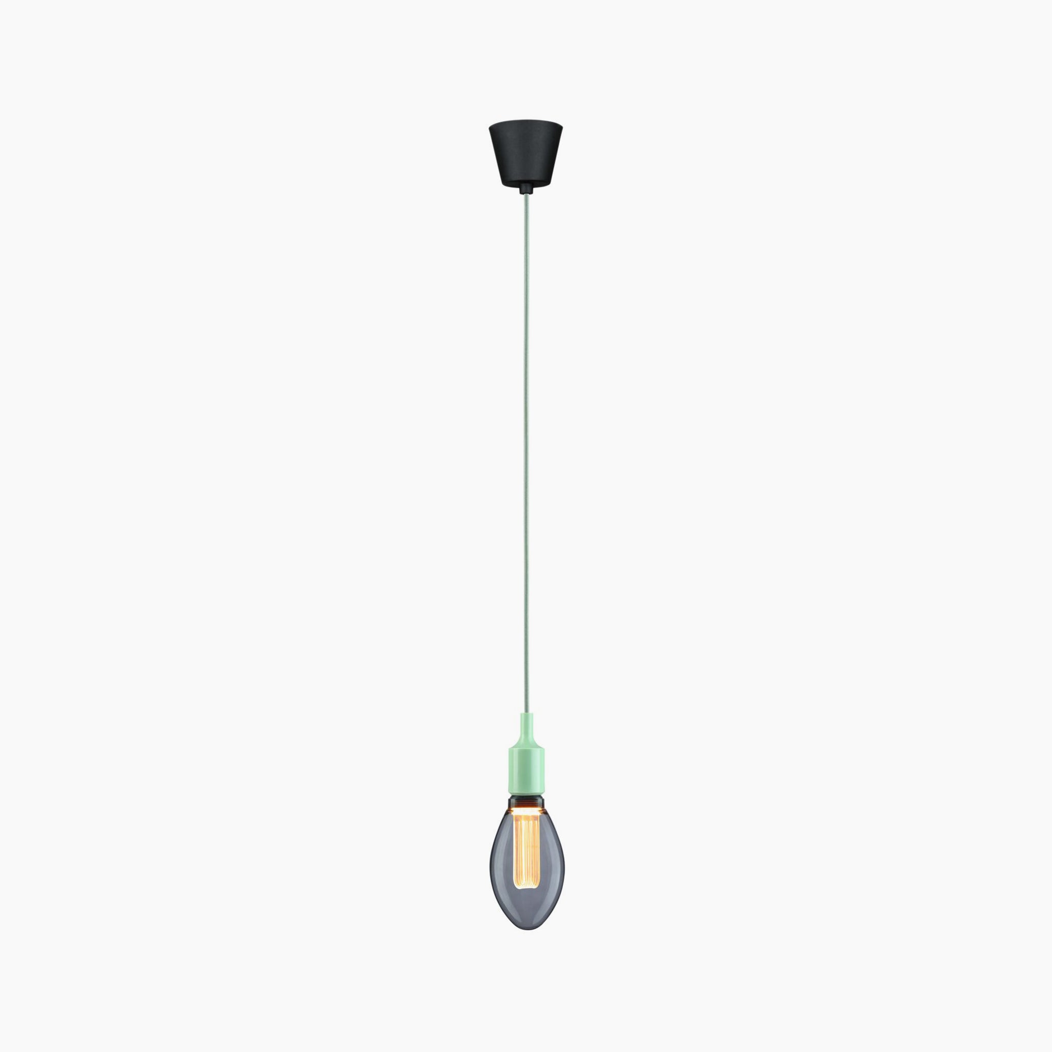 Introducing the Paulmann - Neordic Ketil 60W Dimmable Pendant Light in Light Green, featuring a minimalist design with a black bulb holder, mint green cord, silicone accents, and an exposed amber E27 lamp set against a white background.