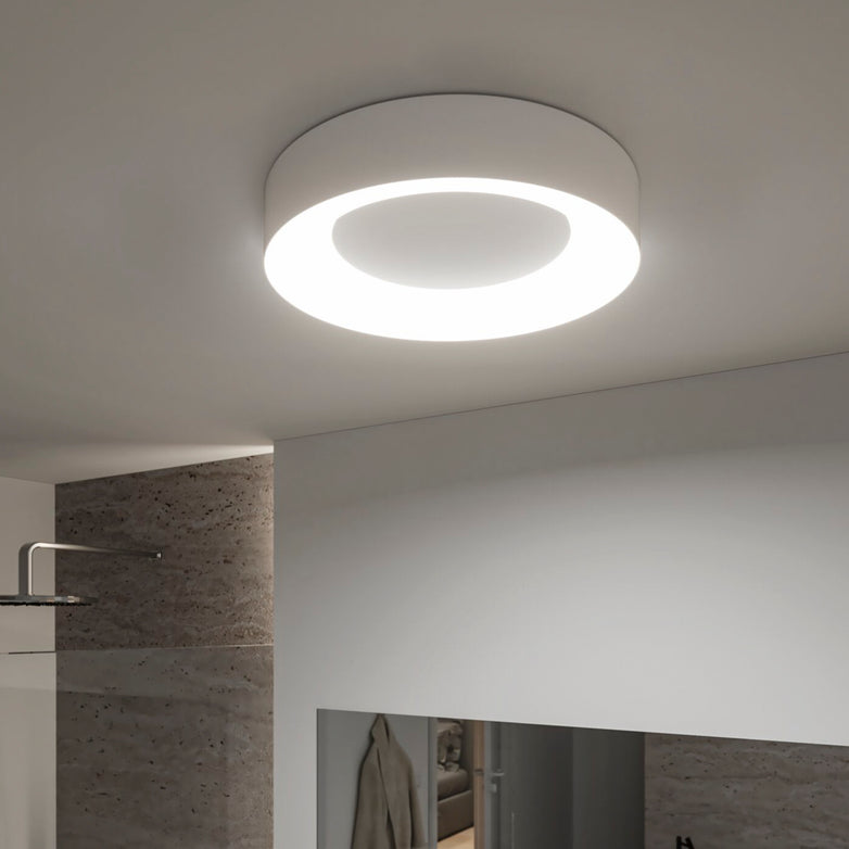 The Casca 25W LED Switch 2100lm Ceiling Light in White graces a contemporary, minimalistic indoor space, providing adjustable light color to create the perfect lighting effect.