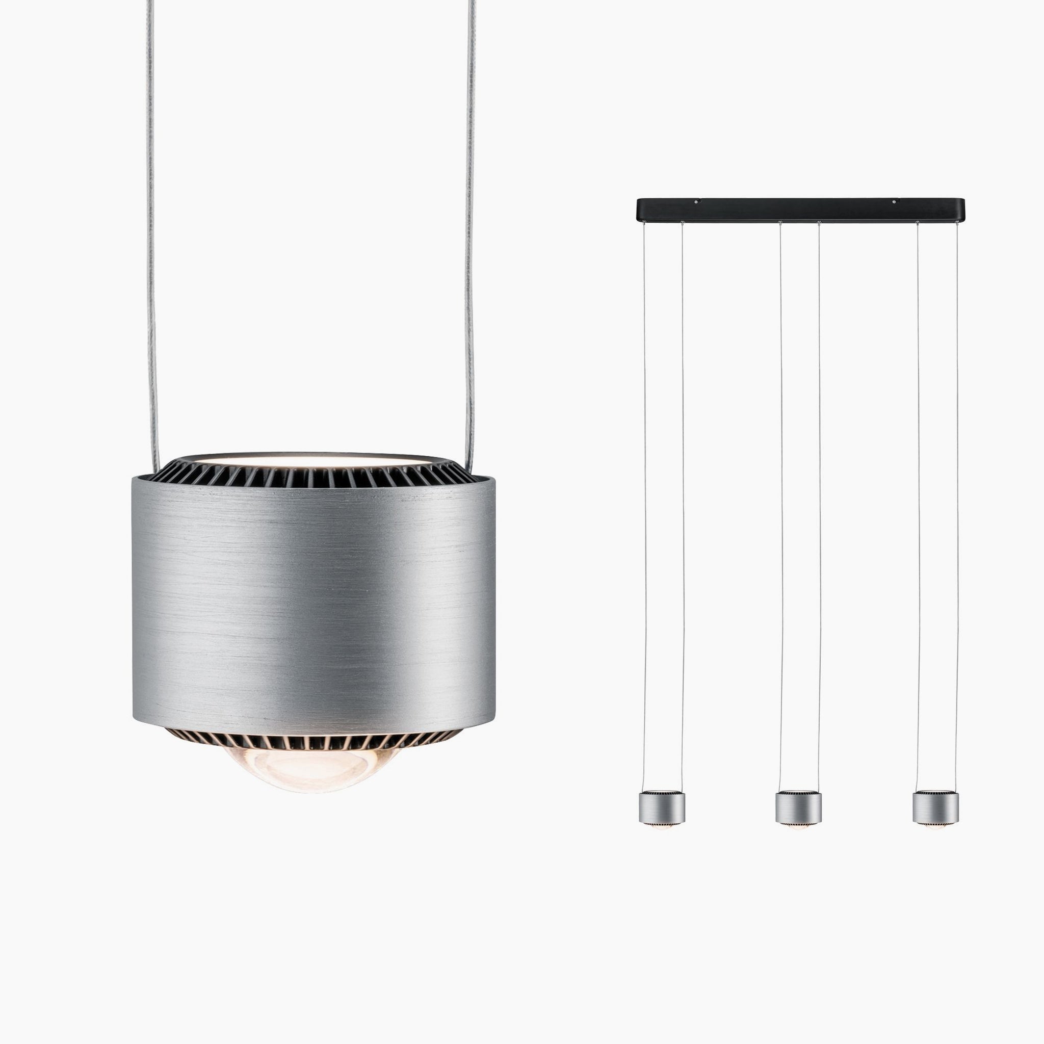 The Aldan 28W LED Dimmable 3 Lamp Pendant Light in Brushed Aluminium showcases a modern cylindrical design with three suspension cables and adjustable pendant lengths, featuring an elegant aesthetic and a rectangular ceiling mount.