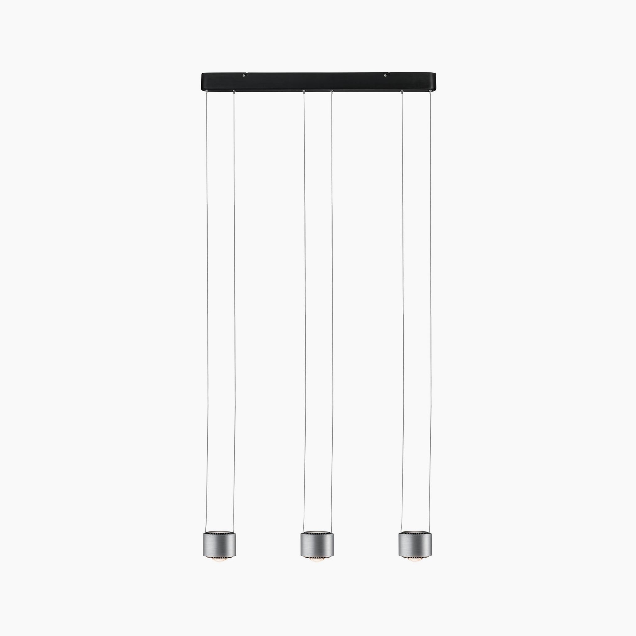 The Aldan 28W LED Dimmable 3 Lamp Pendant Light in Brushed Aluminium offers a contemporary design with three hanging cylindrical fixtures suspended from a rectangular black base, featuring adjustable pendant lengths for a customizable and elegant look.