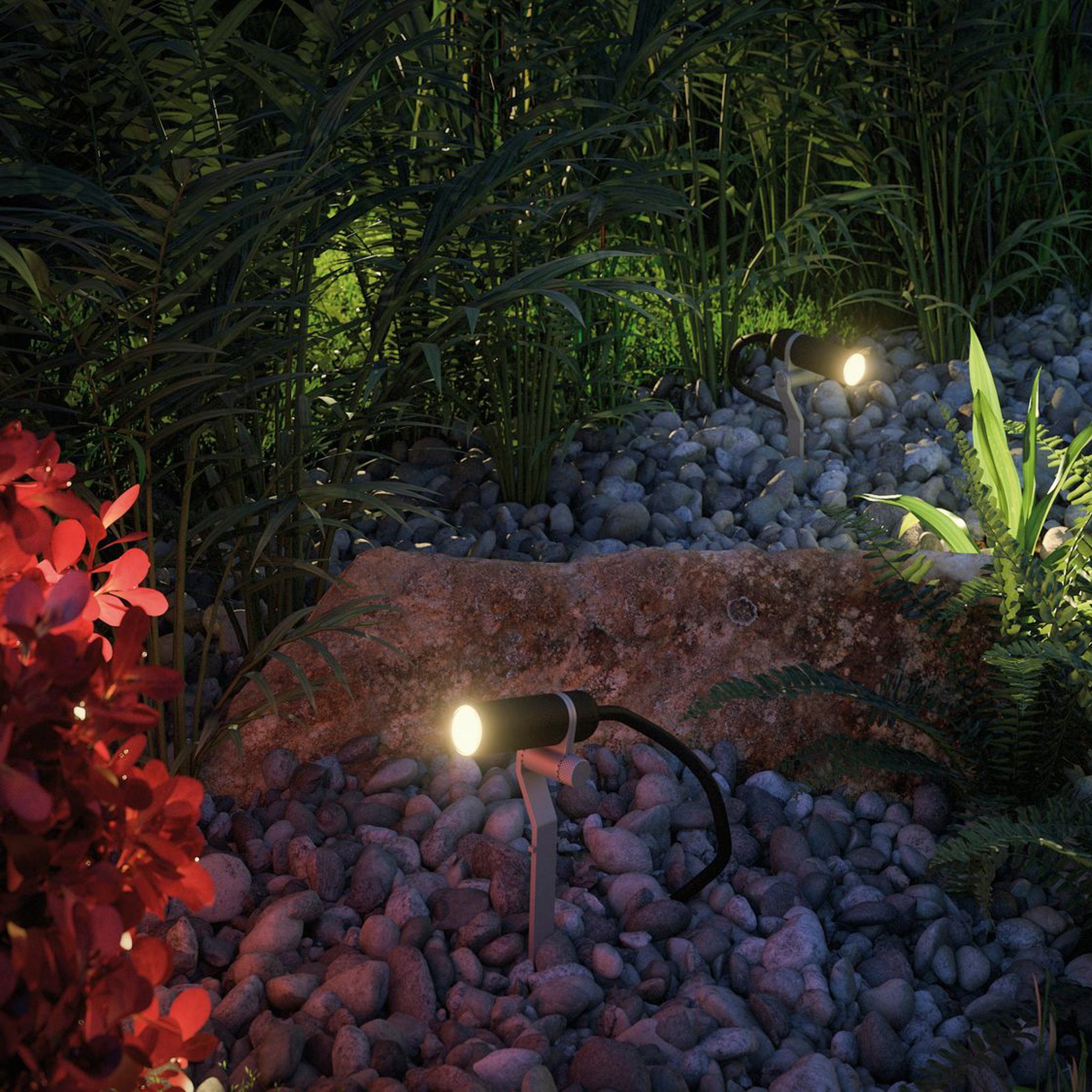 The garden transforms at night with the Paulmann - Plug & Shine Outdoor Plantini 2W LED Expansion Set in Anthracite, which includes weather-resistant spotlights that brighten rocks and plants. This 24 V lighting system guarantees both durability and brilliance regardless of the conditions.