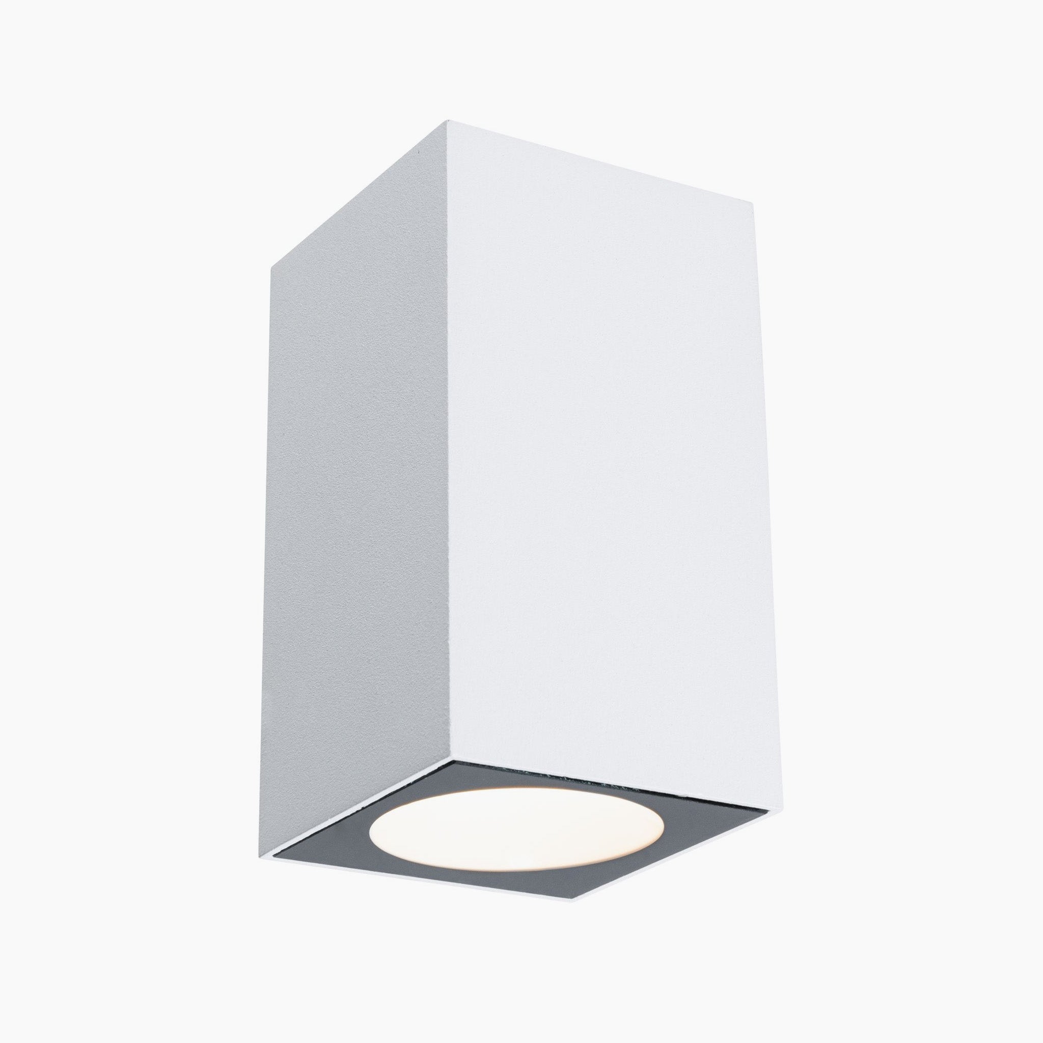 White rectangular surface-mounted ceiling light fixture from Paulmann, featuring a circular bulb opening at the bottom and modern LED technology, known as the Outdoor Flame 5.2W LED Single Output Wall Light in White.