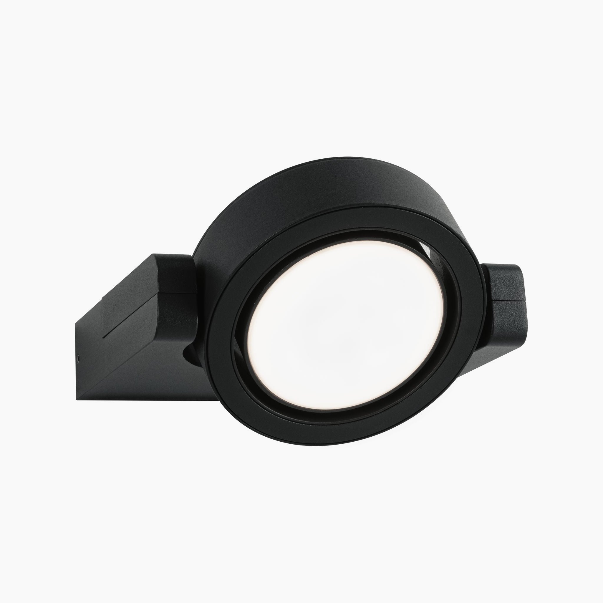 The Outdoor Swivea 8W LED Wall Light in Anthracite by Paulmann features a minimalist black circular design, ideal for exterior walls. This sleek wall-mounted spotlight offers versatile lighting that beautifully enhances any white backdrop.