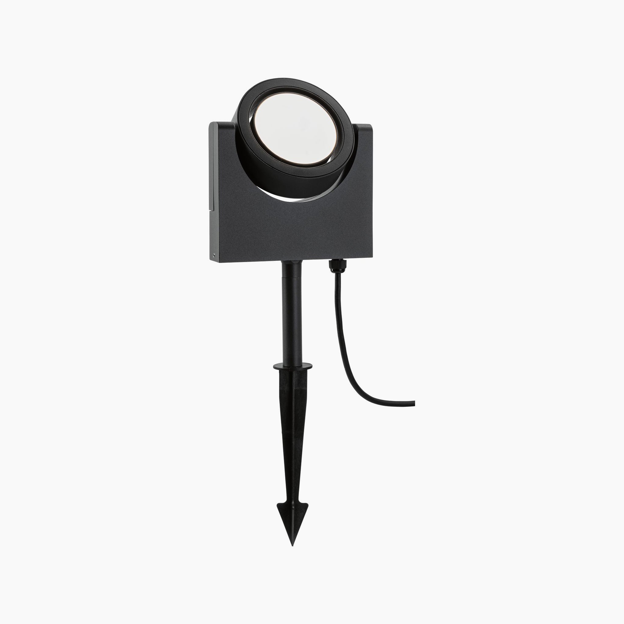 The Paulmann Outdoor Swivea 8W LED Garden Spotlight in Anthracite boasts a modern design with a sleek finish, complete with a ground spike and power cord. It illuminates outdoor areas with warm white light, combining style and functionality seamlessly.