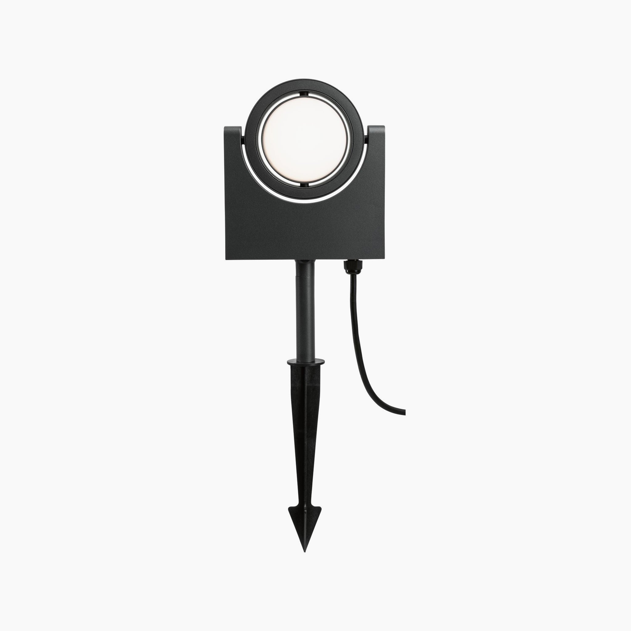 Introducing the Paulmann Outdoor Swivea 8W LED Garden Spotlight in Anthracite—a sleek outdoor fixture with a rectangular base and stake, featuring a circular light that emits a warm white glow. Its contemporary design effortlessly combines style and functionality, making it ideal for illuminating any landscape.