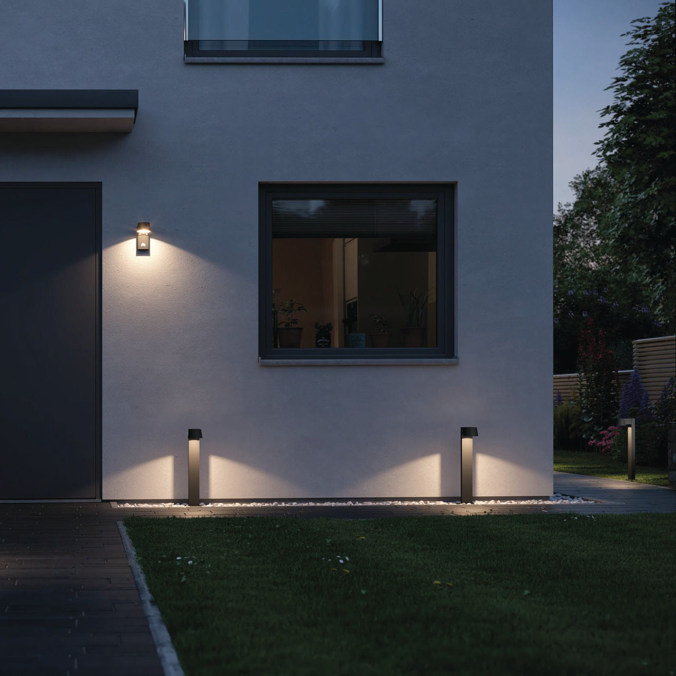 With the Paulmann Outdoor Capea 8W LED Bollard Light in Anthracite, your modern house exterior is enhanced at dusk with illuminated wall lights and path lights, offering both elegance and safety. These waterproof bollard fixtures add durability while casting a warm glow that beautifully accentuates the contemporary design.