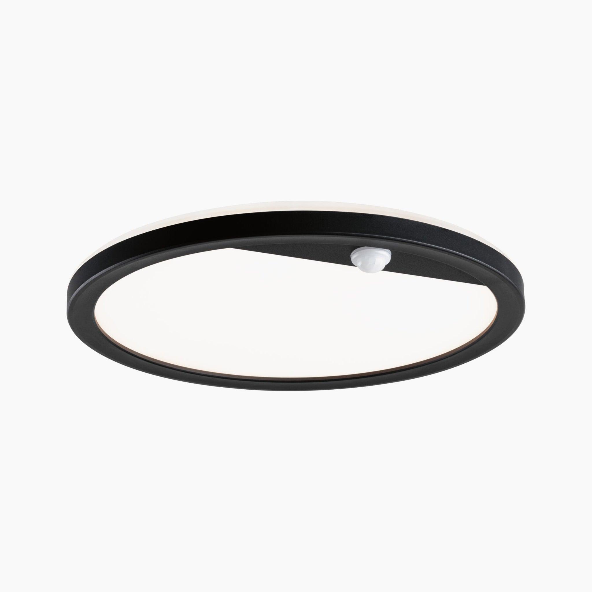 An outdoor light fixture by Paulmann, featuring a round, black design with a frosted white shade that emits a warm white glow; it includes 15.5W LED backlighting and motion detection functionality.