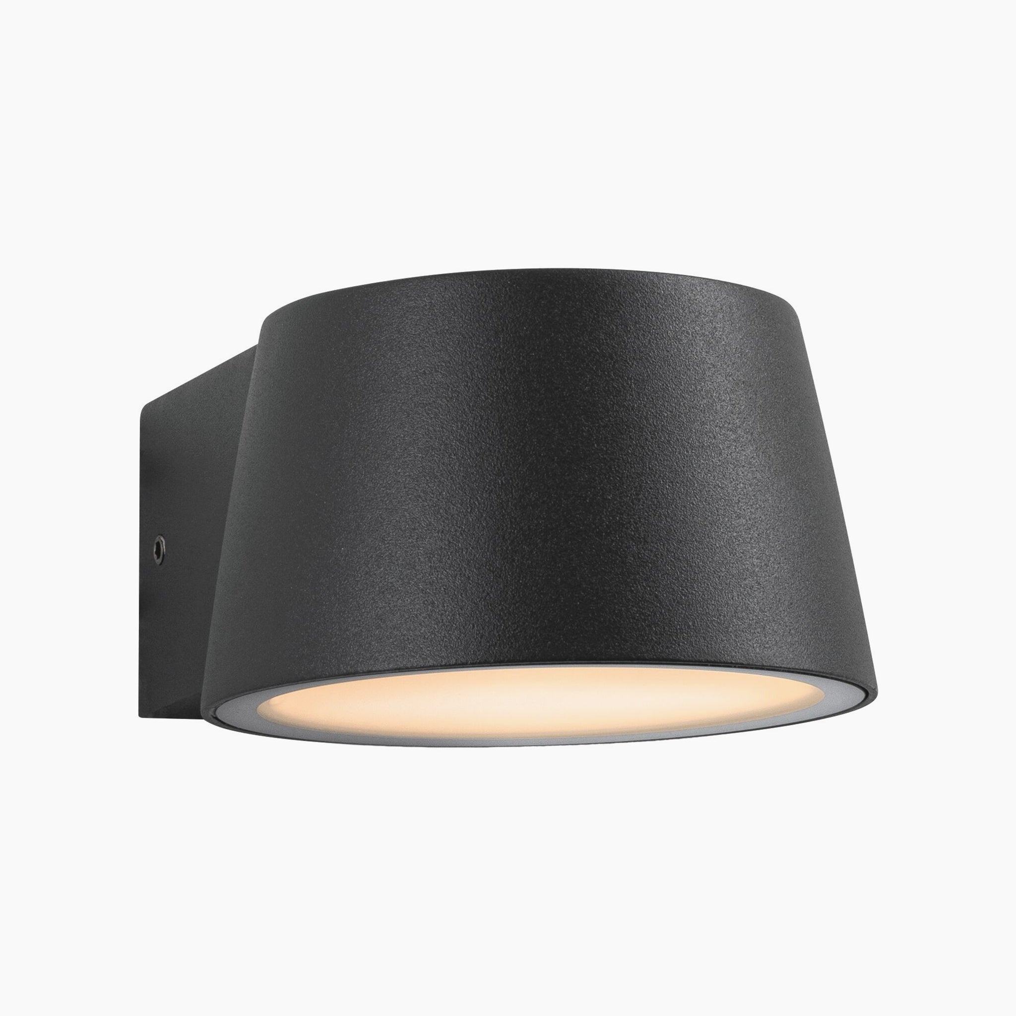 An anthracite Outdoor Capea 8W LED wall light with a cone-shaped design and a frosted circular cover, emitting a warm gold light that is insect-friendly.