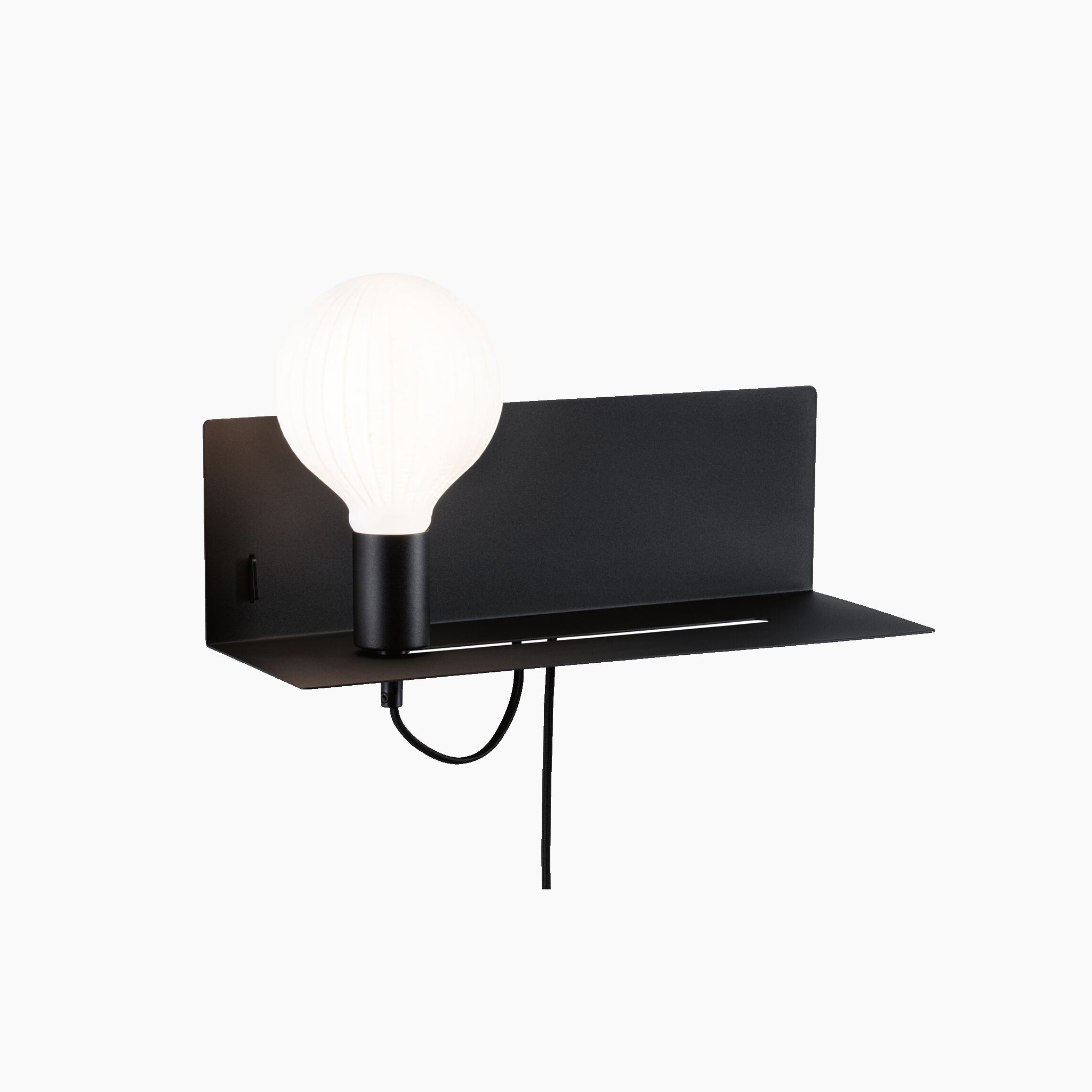 Presenting the Devara 40W Wall Mounted Lamp with USB Port in Black Matt, a minimalist lighting solution featuring a large round bulb on an integrated black metal shelf, complete with an attached power cord and USB-C charging port.