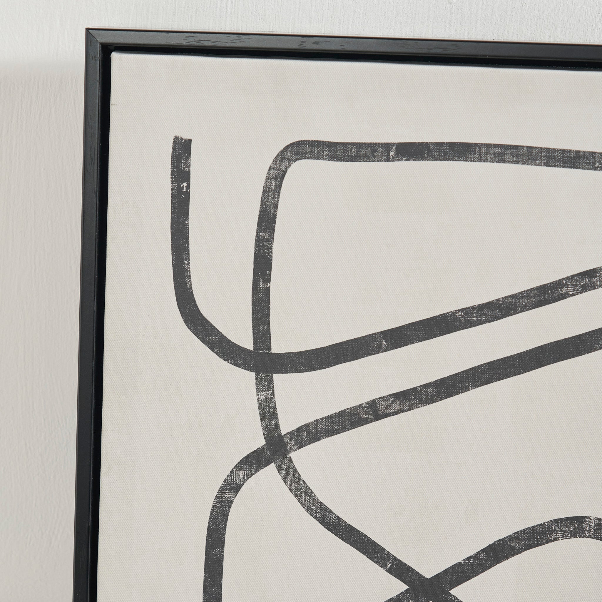 The Black Squiggle Print Canvases with Black Frames provide an exquisite piece of monochrome wall art, featuring abstract black line designs on a beige canvas. Ideal for elevating your interior decor, this artwork adds a sophisticated touch to any space, drawing attention with its understated elegance.