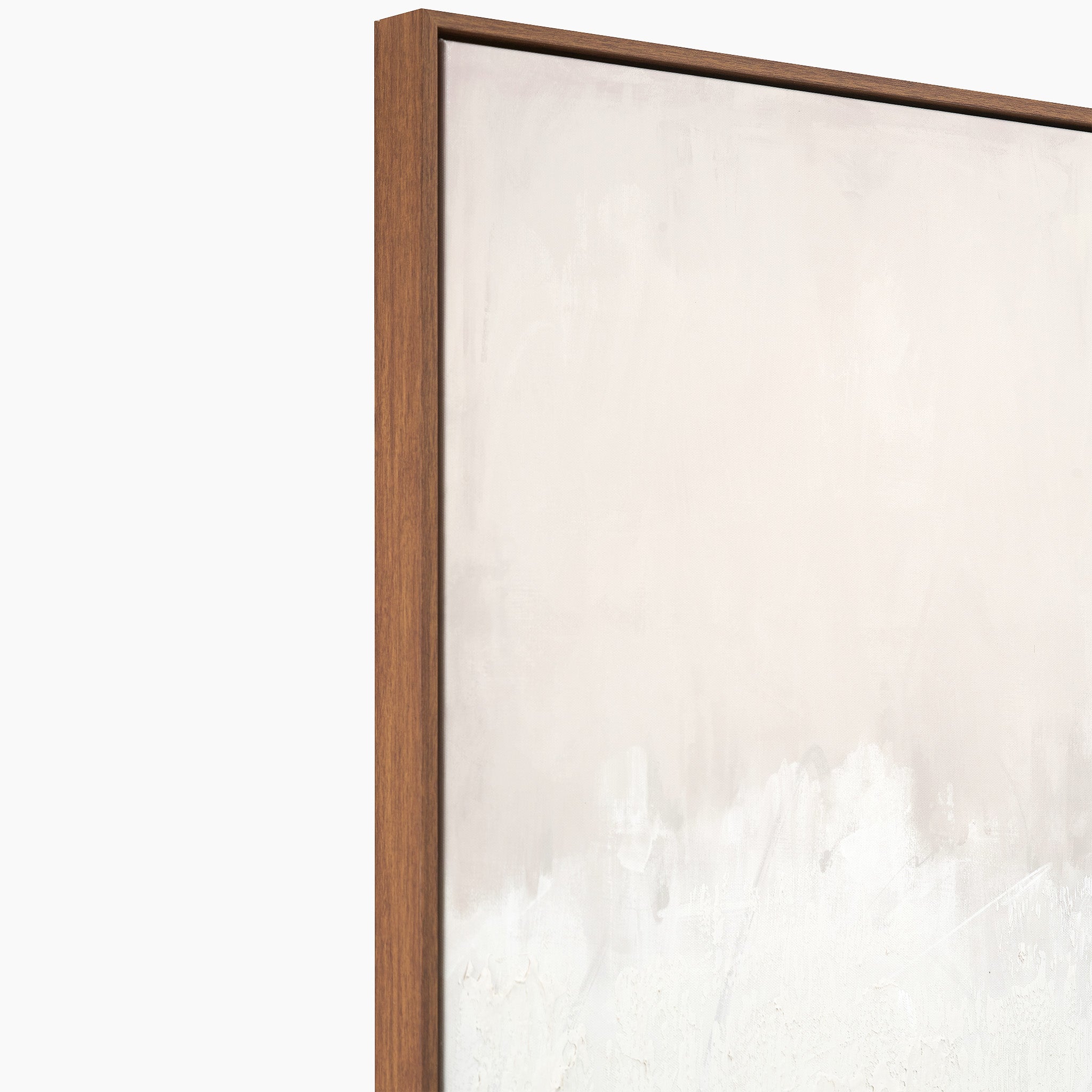 The Natural and White Abstract Canvas with Natural Frame Large showcases a minimalist design featuring a light beige gradient, elegantly presented in a natural wood frame. Seen from a side angle against a white backdrop, it seamlessly complements various interior styles.