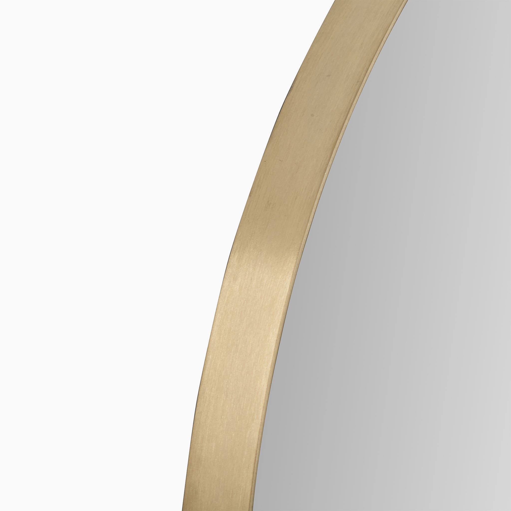 Close-up of the Brushed Gold Metal Slim Frame Round Wall Mirror Large, showcasing its contemporary minimalist design with a sleek brushed gold finish against a white background.