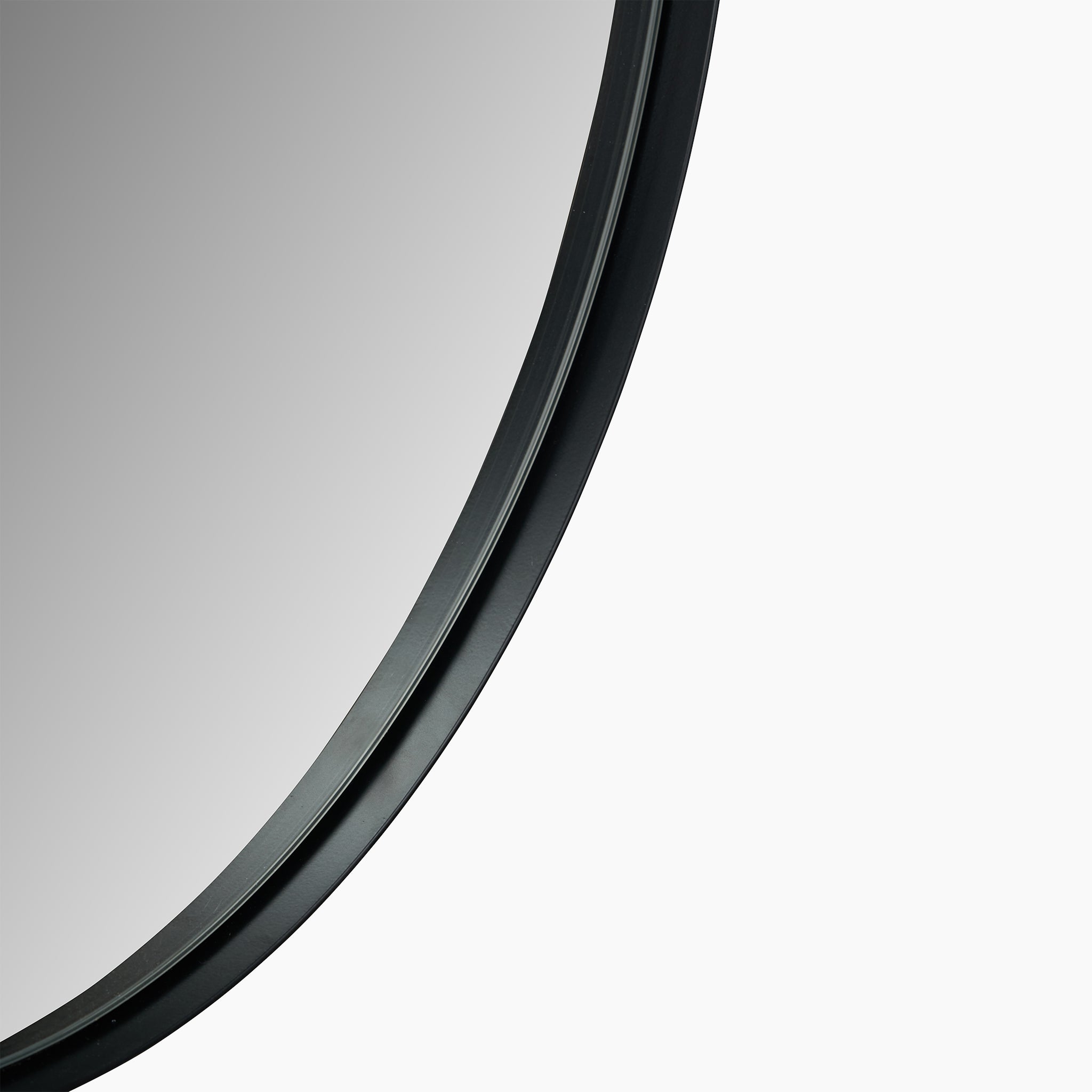 Here's a close-up view of the Black Metal Slim Frame Round Wall Mirror Large, showcasing its elegantly reflective surface bordered by a slim frame with a matt black finish.