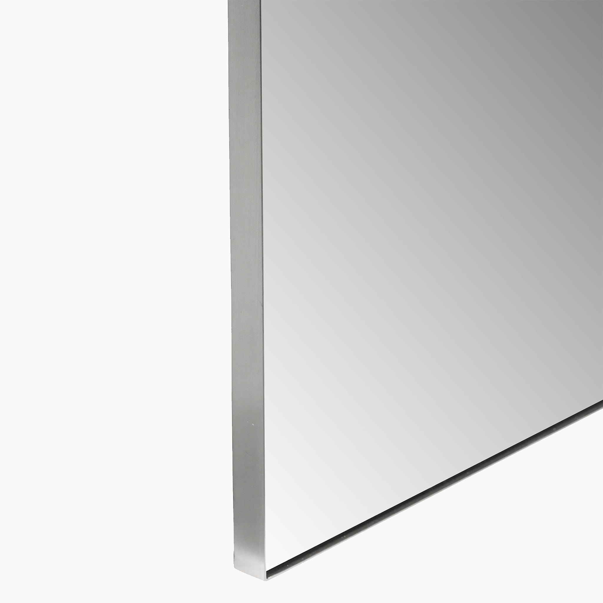 A side view of the Brushed Silver Metal Slim Frame Arch Floor Mirror, reflecting light on a plain white background. Its minimalist design is perfect for adding a touch of modern decor.