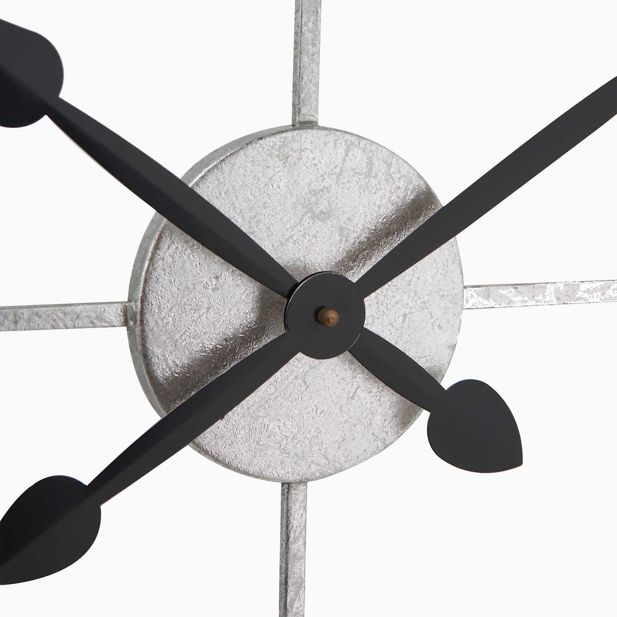 Close-up of the Antique Silver Metal Round Wall Clock Large, featuring sleek hands and a minimalist design on a white background, adorned with elegant Roman numerals.