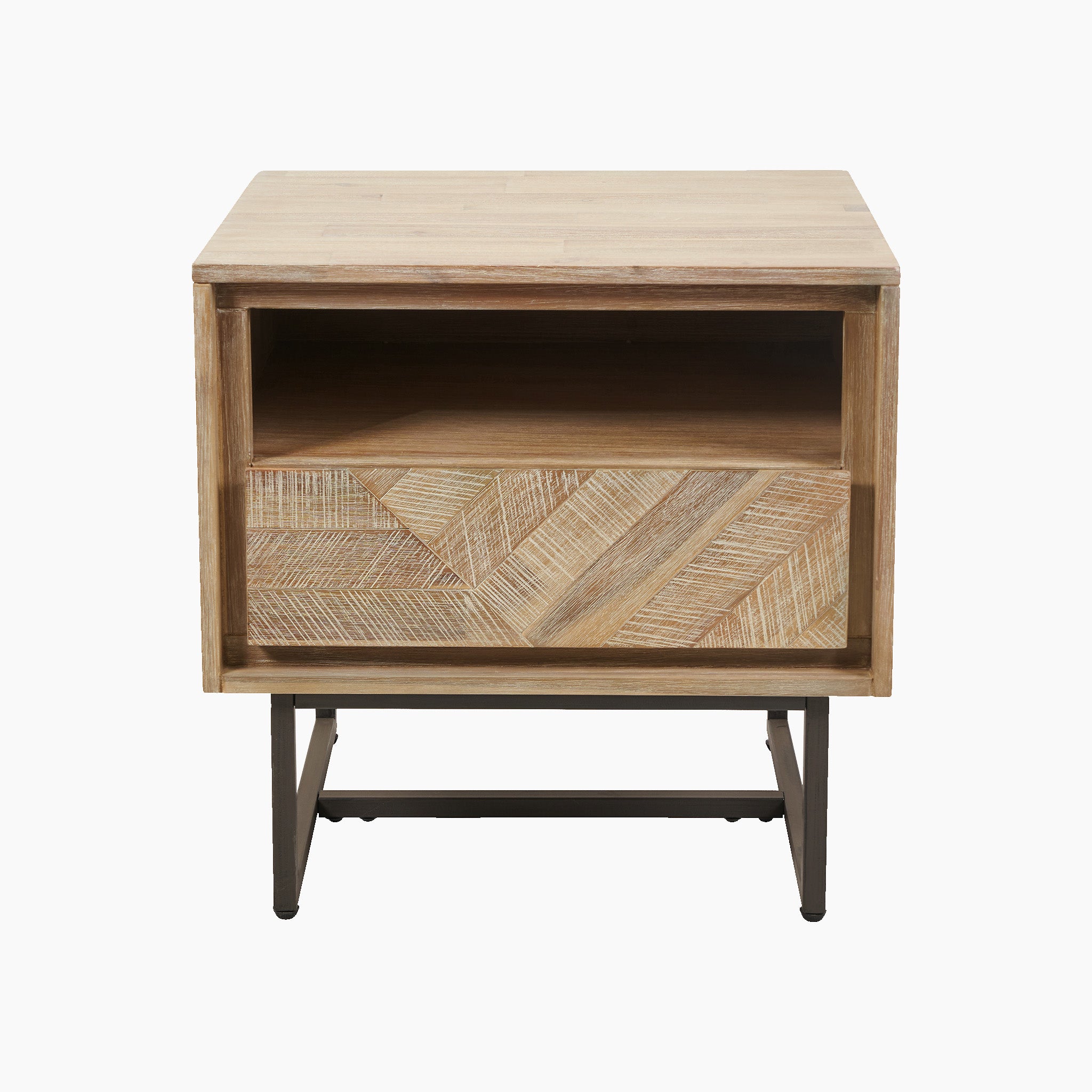 The Marca Sand Wash Acacia Wood and Black Metal Bedside Unit boasts a Scandi-style design, featuring a geometric patterned drawer and an open shelf for ample storage, all elegantly supported by sleek black metal legs.