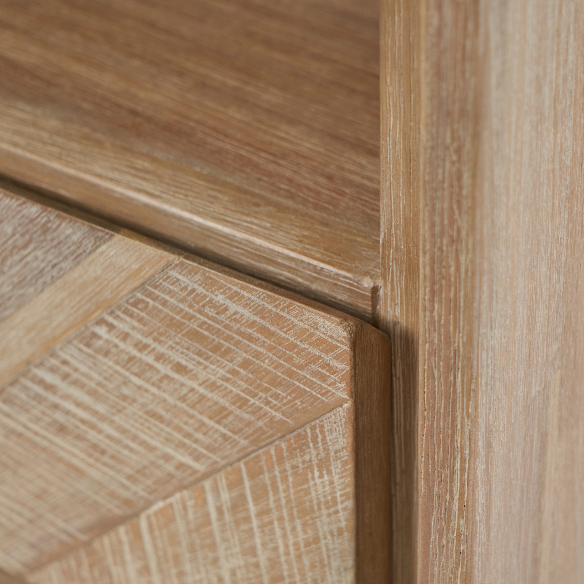 Close-up of the Marca Sand Wash Acacia Wood and Black Metal Bedside Unit, showcasing its Scandi-style, light brown textured wood with diagonal patterns and smooth surfaces.