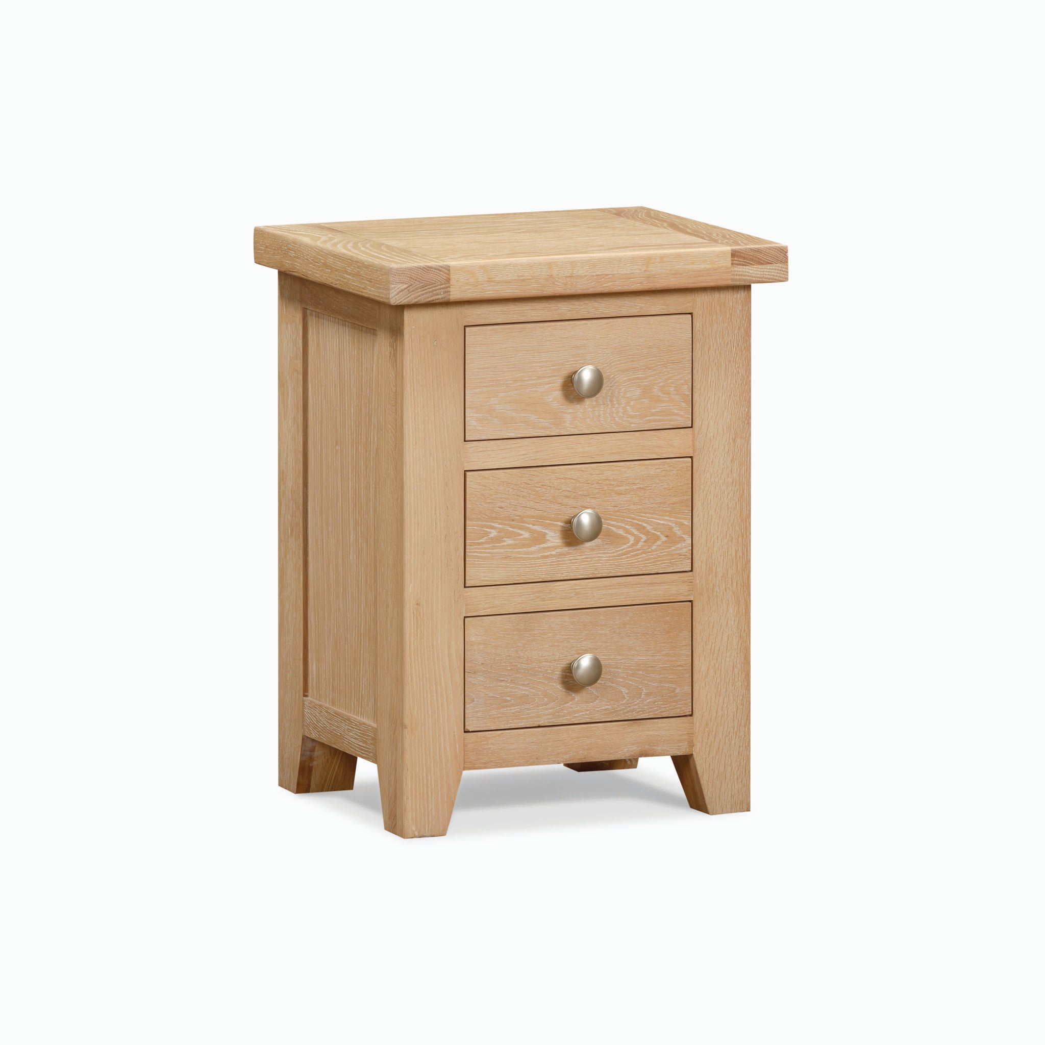 The Burford 3 Drawers Bedside Table in Natural Oak features a light oak with a whitewash finish, and includes three drawers, each adorned with a round metal knob. Set against a plain background, this piece offers ample storage, making it perfect for any bedroom decor.