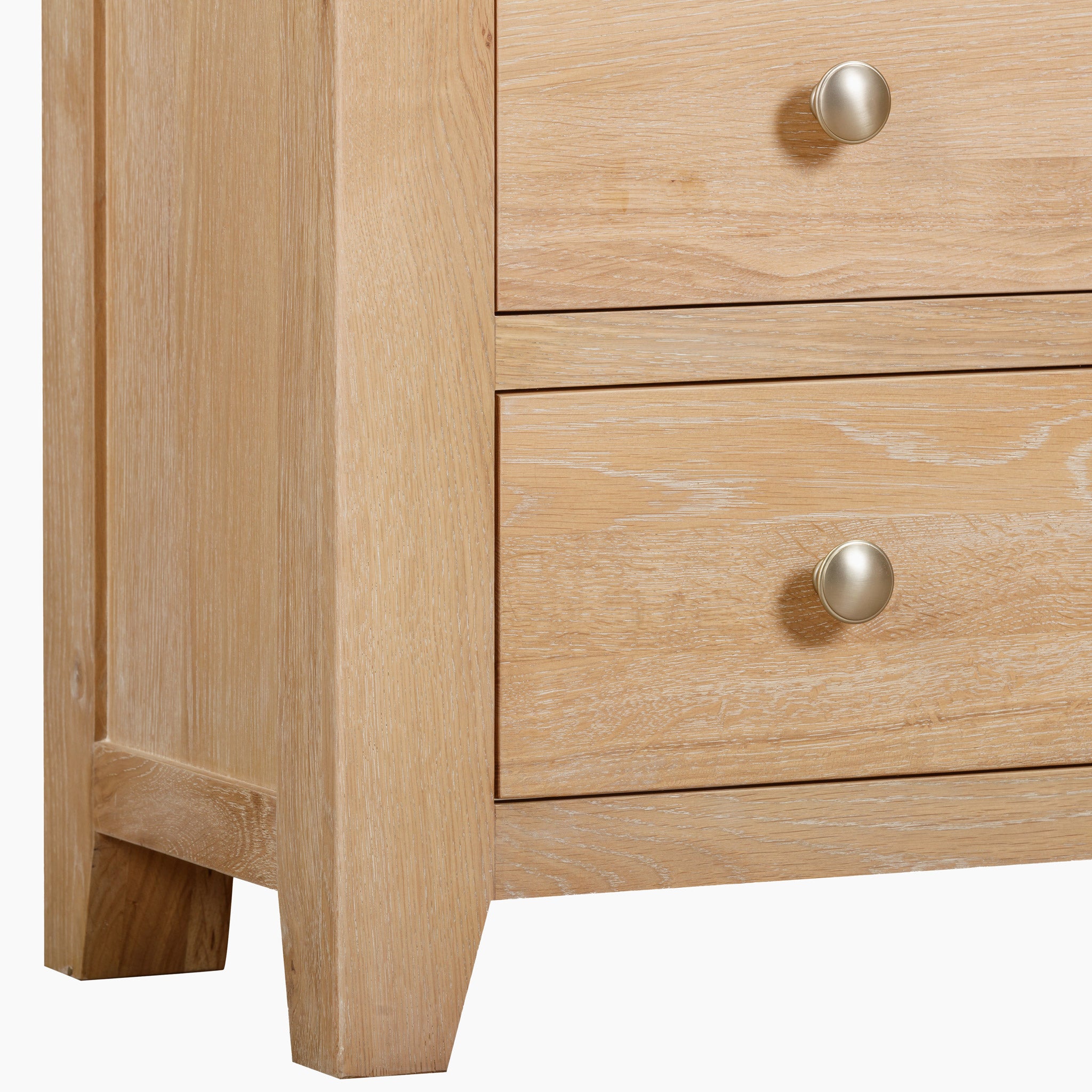 Close-up of the Burford 2 Over 3 Chest of Drawers in Natural Oak, featuring two upper drawers and three lower drawers, each enhanced with round metal handles, providing ample storage solutions.