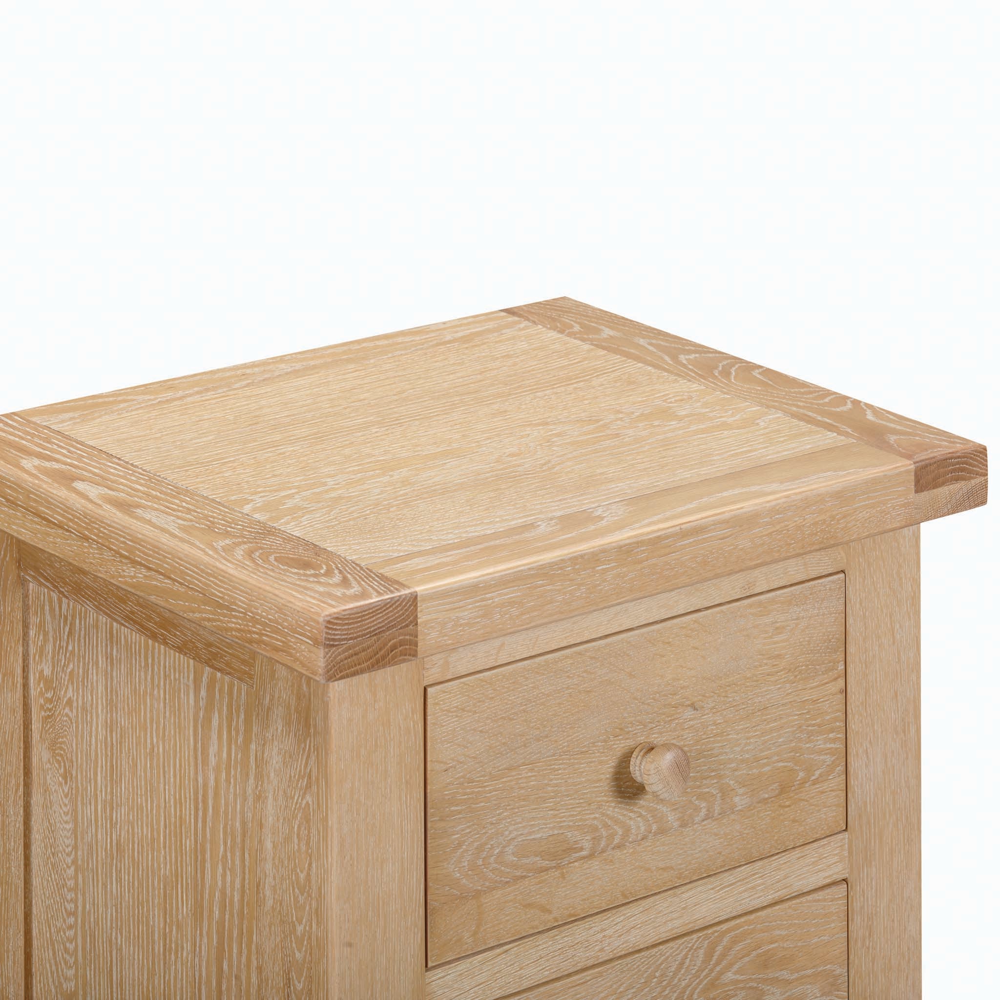 This light wooden cabinet with its clean lines and natural finish is reminiscent of the Burford 5 Chest of Drawers in Natural Oak. The piece offers a top surface and a partially visible drawer, making it an elegant storage solution in natural oak.