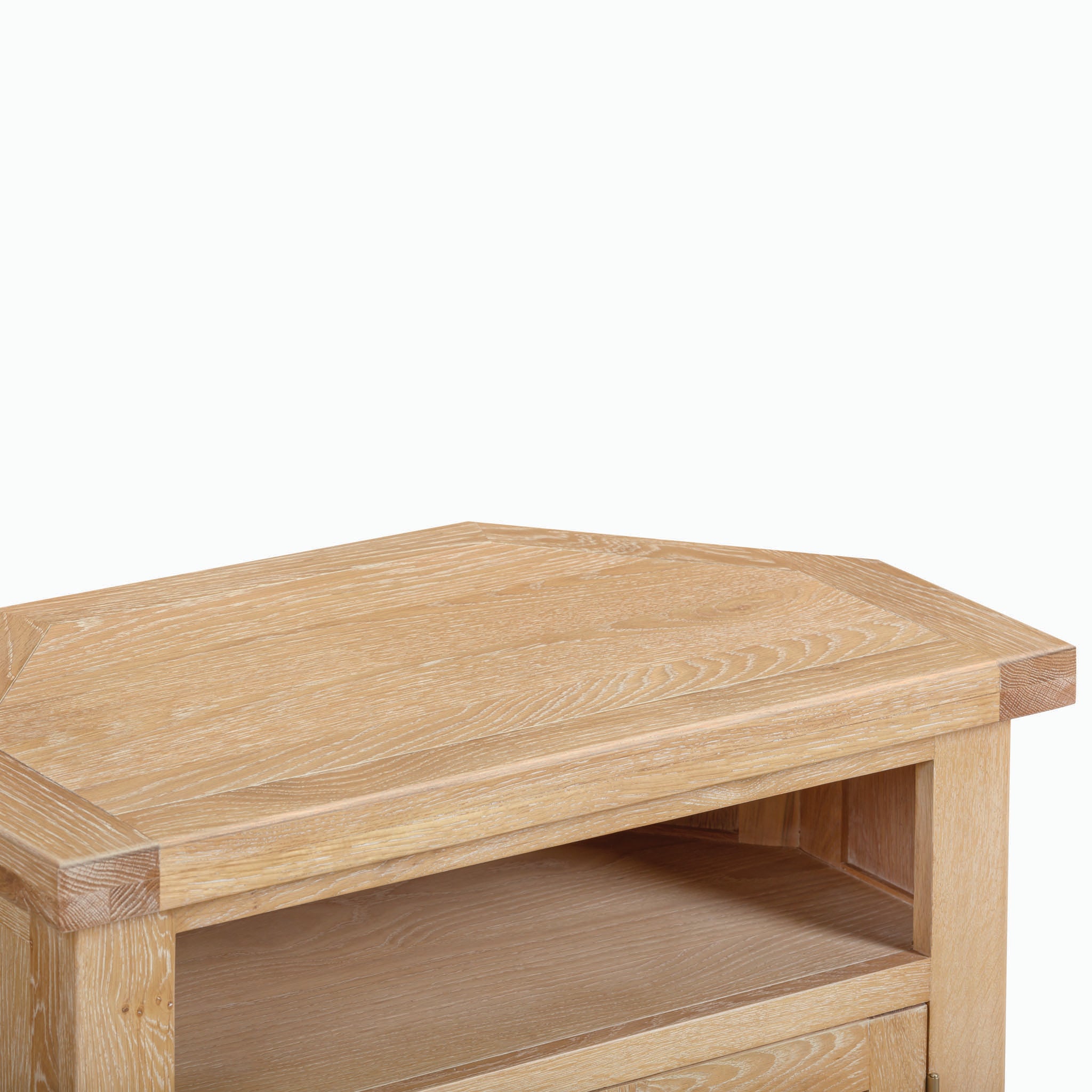 Close-up of the top section of a Burford Corner Media Unit in Natural Oak, showcasing the natural oak wood's rustic charm with a shelf underneath.