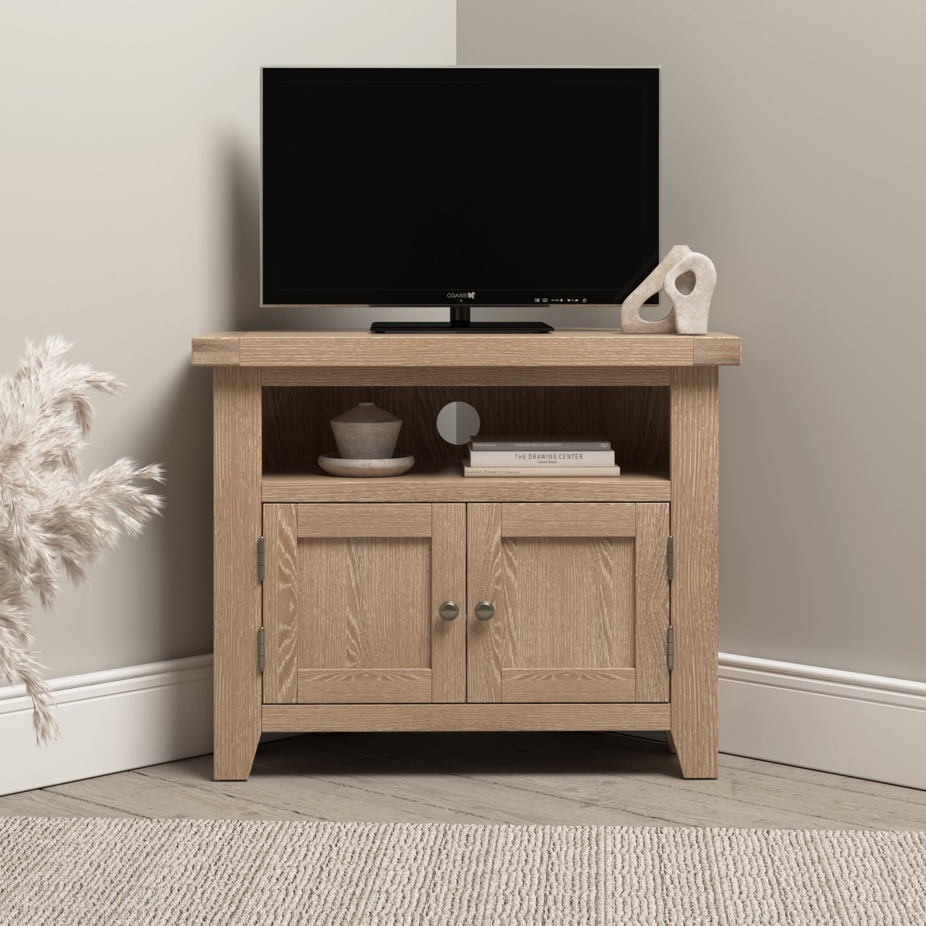 The Burford Corner Media Unit in Natural Oak brings a rustic charm to your living space. This wooden corner TV stand comfortably holds a black flat-screen TV, along with books and decorative items, while beige walls and carpet enhance the cozy ambiance.