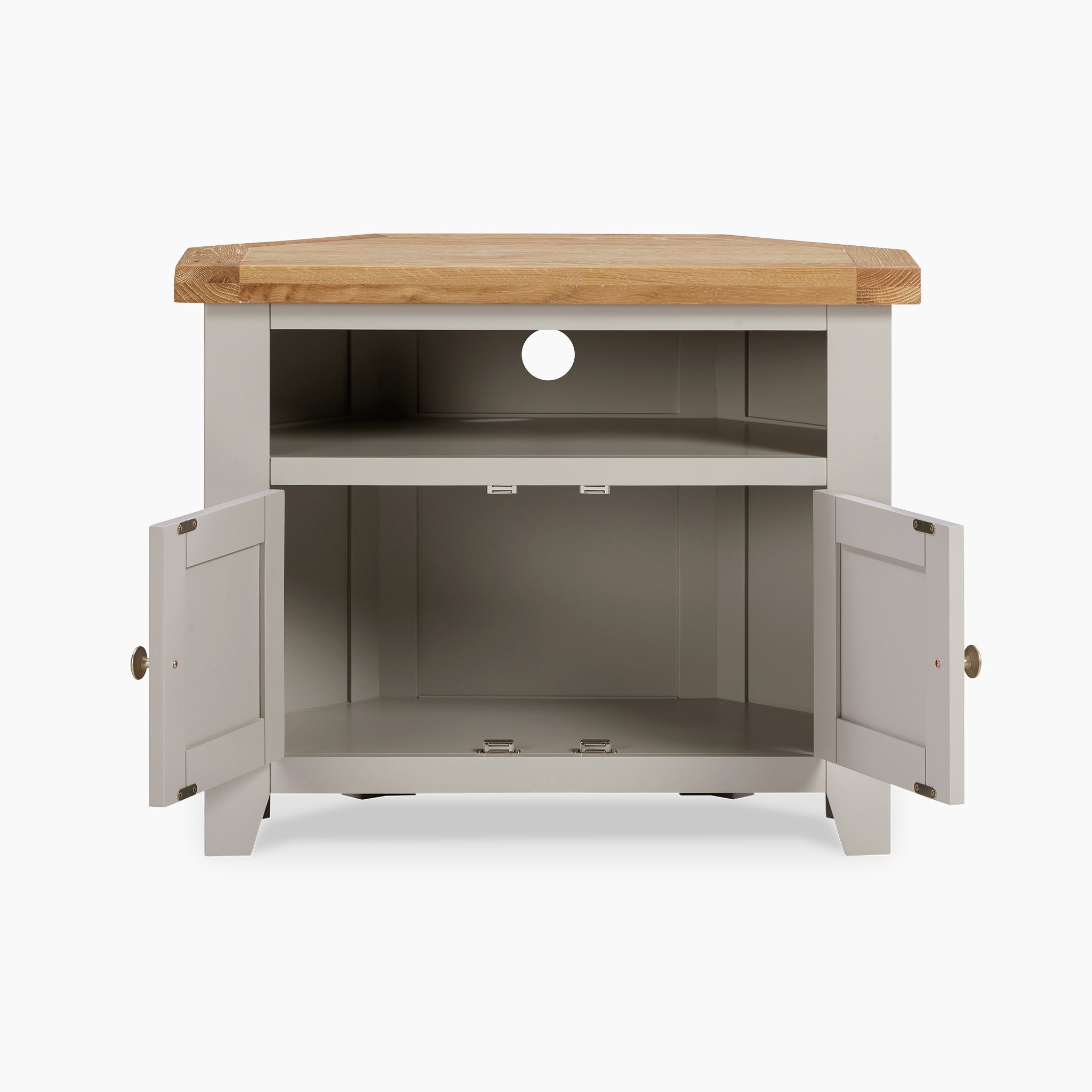 The Burford Corner Media Unit in Pebble Grey is a two-door media unit featuring a natural oak top, interior shelves, and a back opening for cables, bringing rustic charm to any space.