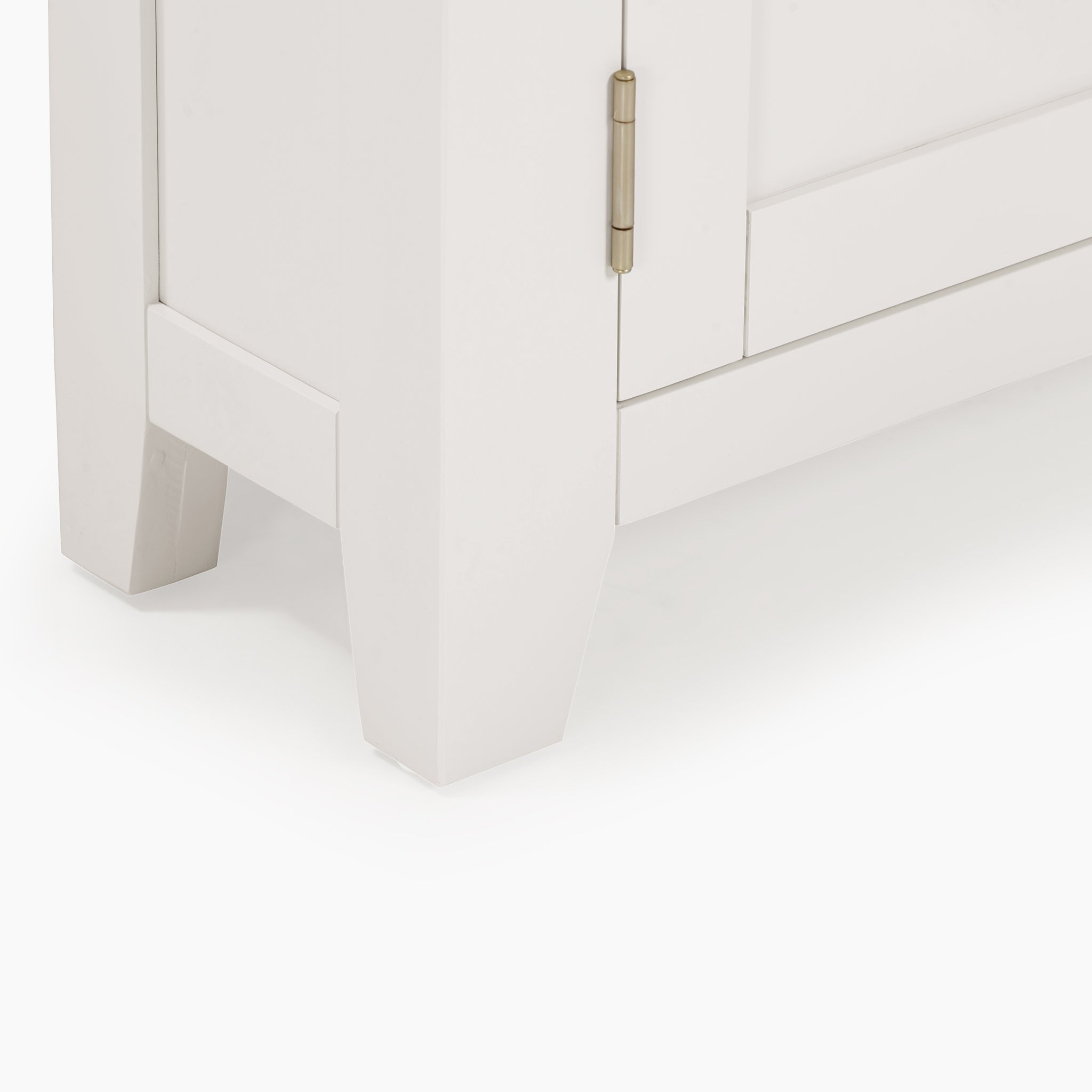 Close-up of the Burford Corner Media Unit in Warm White, showcasing its open shelf and door with a brass hinge, set against a white background.