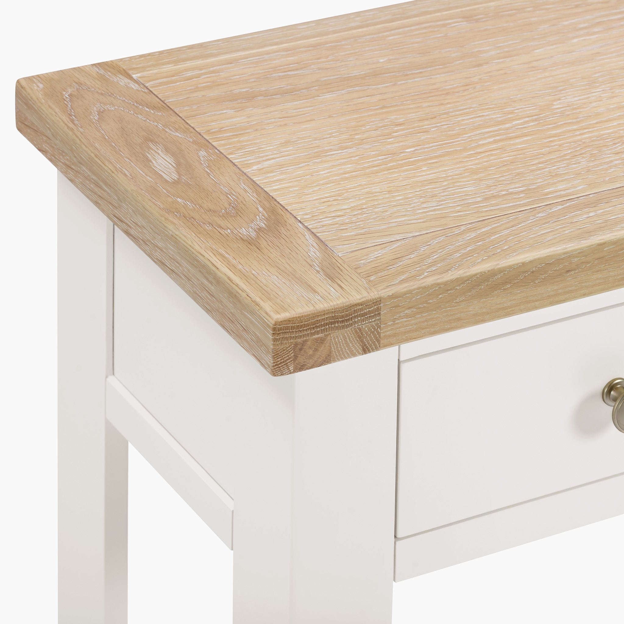 Close-up of the Burford 2 Drawers Console Table in warm white, highlighting its light natural oak top and featuring a small drawer with a metal knob.