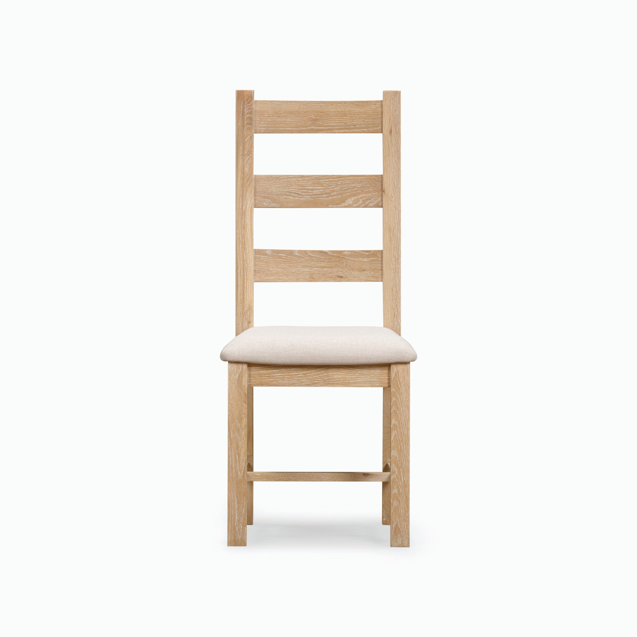 Front view of the Burford Ladderback Dining Chairs with Fabric Seat in Natural Oak, showcasing a padded light beige upholstered fabric seat and horizontal back slats.