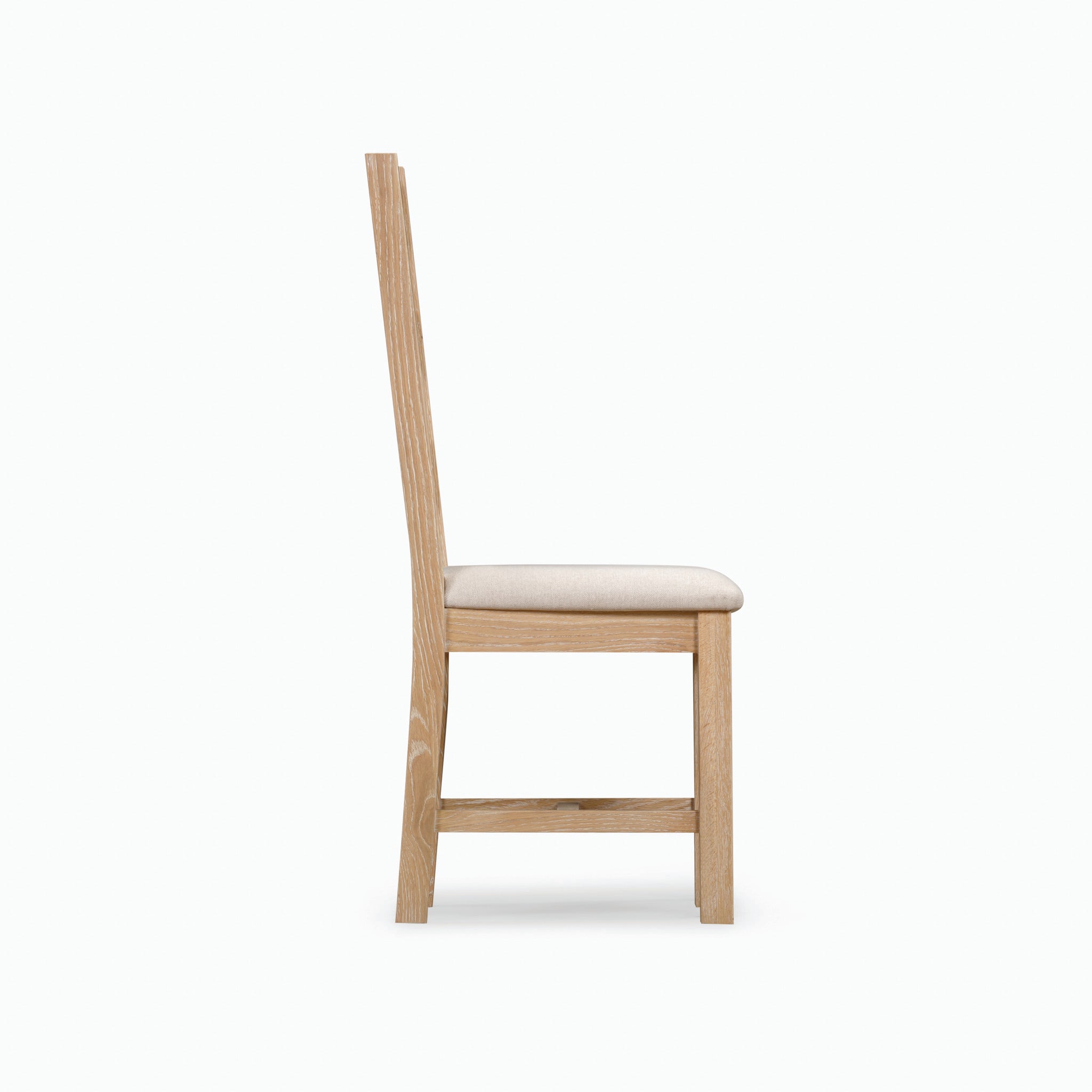 Side view of the Burford Ladderback Dining Chairs with Fabric Seat in Natural Oak featuring a straight back and beige upholstery, set against a white background.