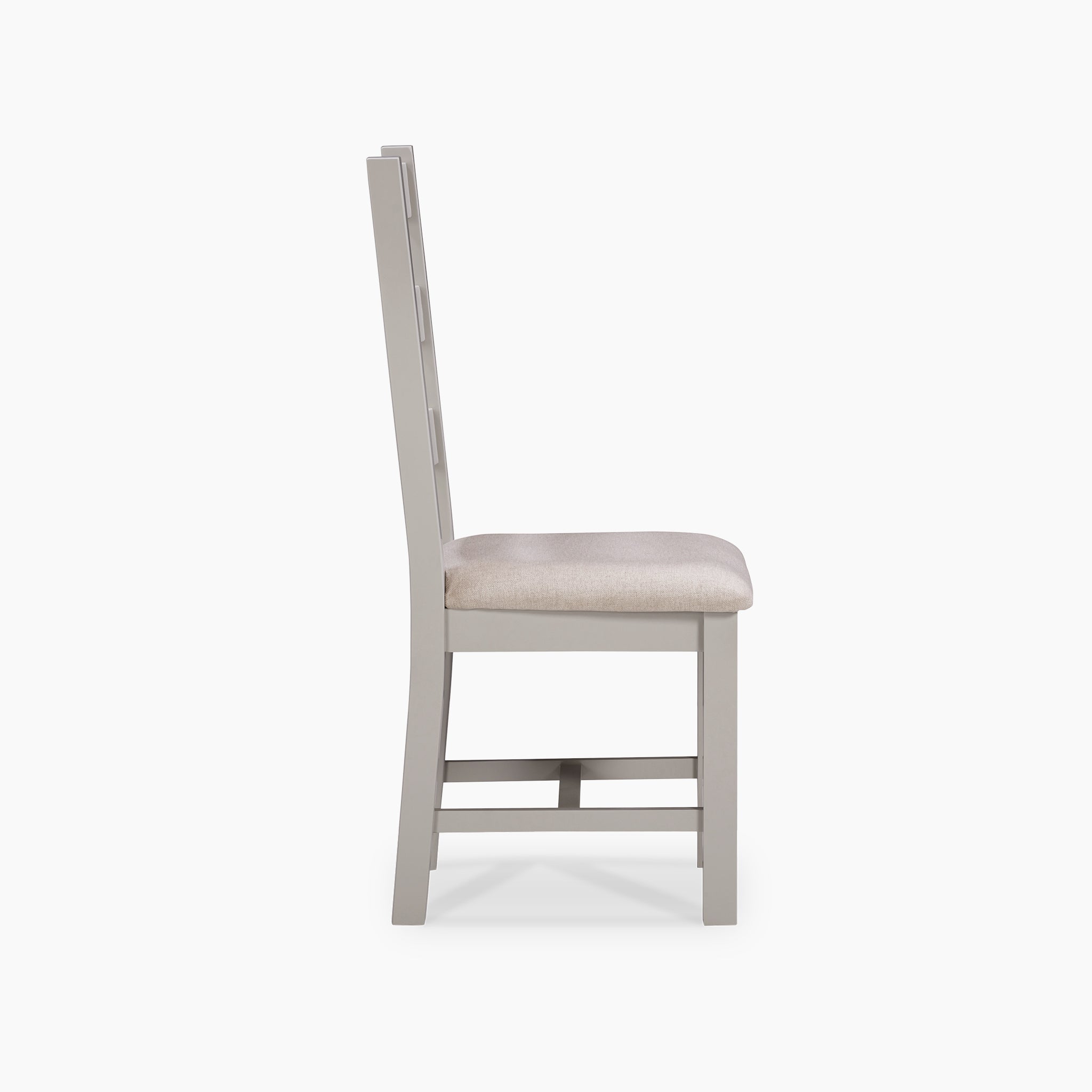 Side view of the Burford Set of 2 Ladderback Dining Chairs in natural oak, showcasing a pebble grey fabric seat against a pristine white background.