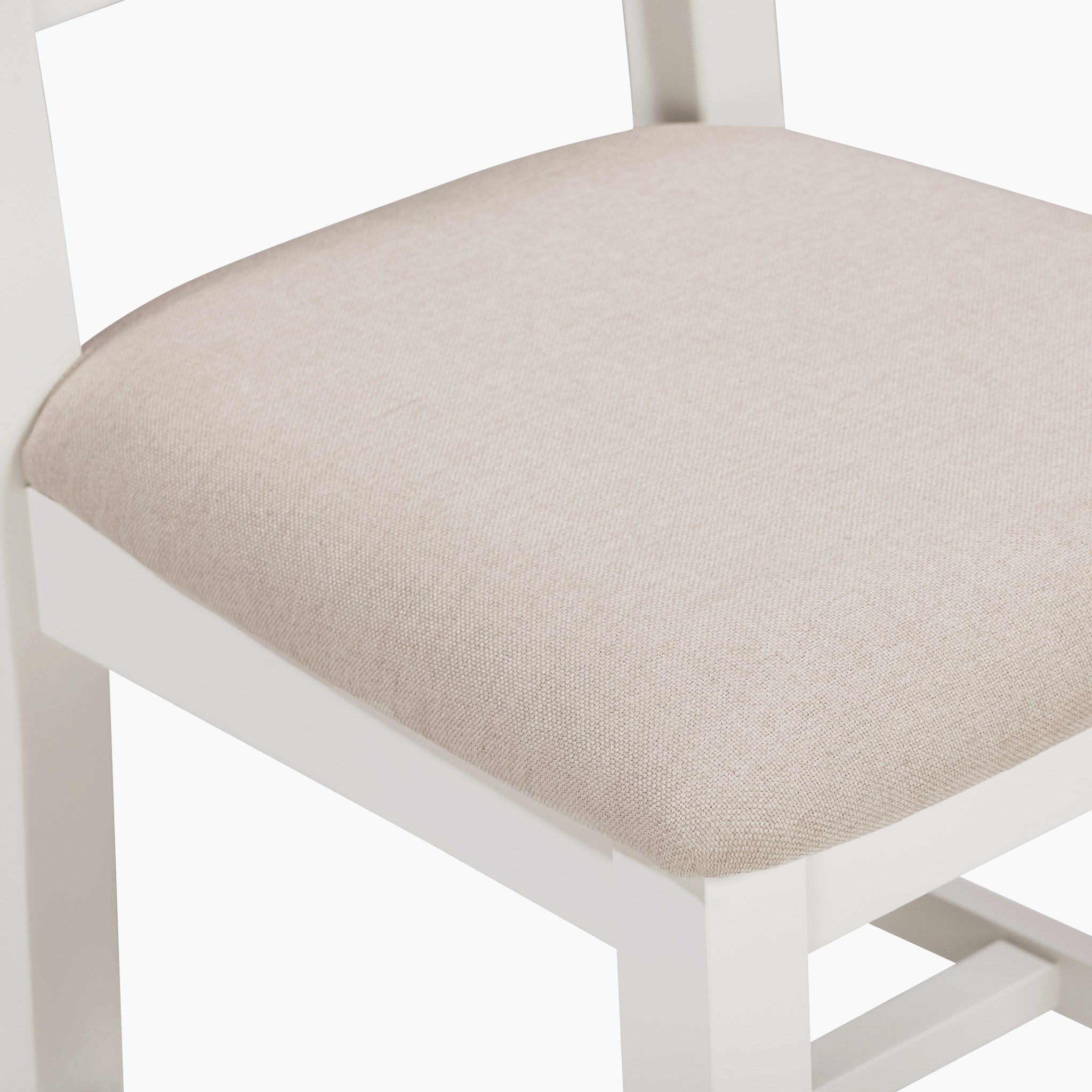 The Burford Set of 2 Ladderback Dining Chairs includes fabric seats and a warm white finish.