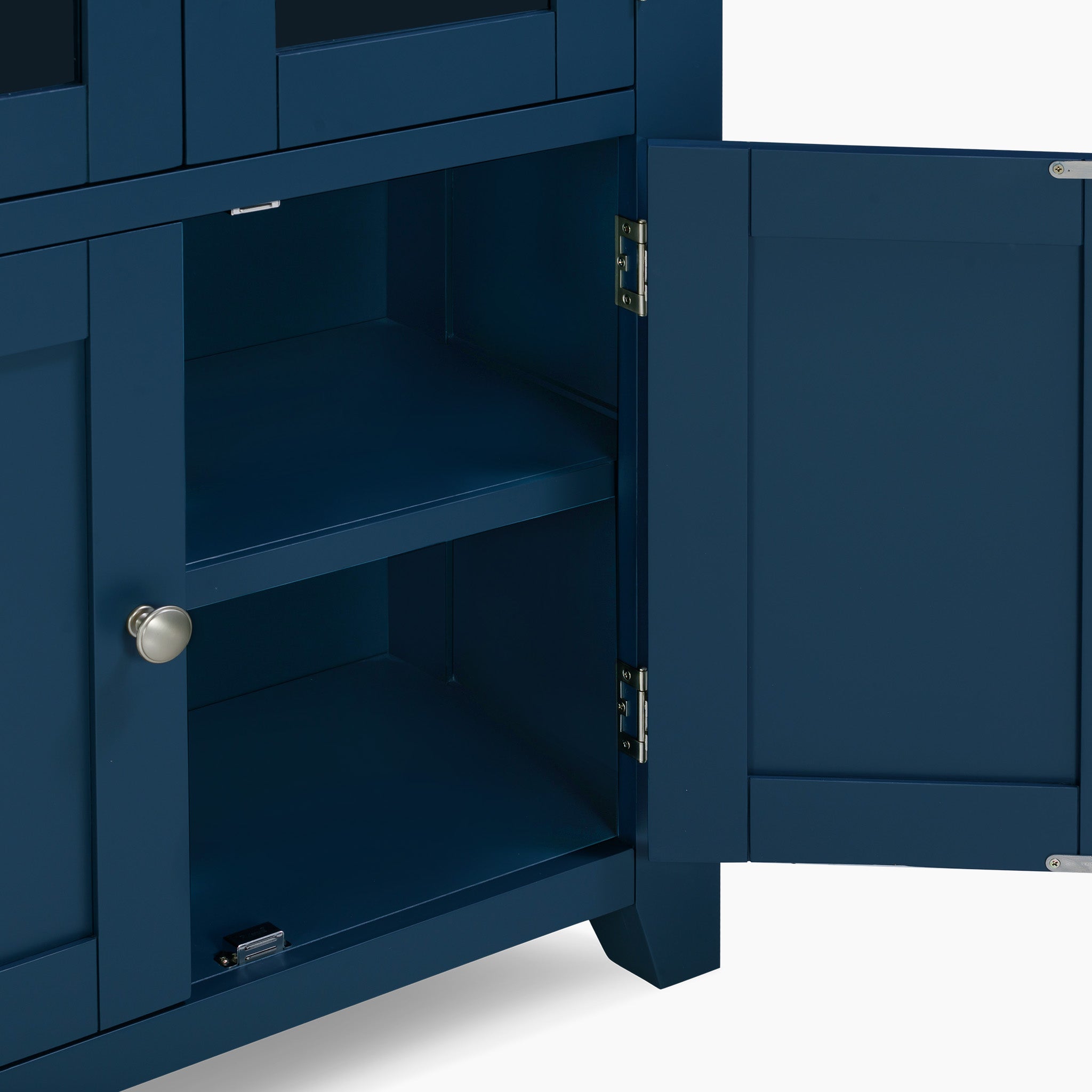 The Burford Display Cabinet in Navy Blue showcases an open design featuring a silver knob and two empty shelves, beautifully contrasted by its natural oak detailing.