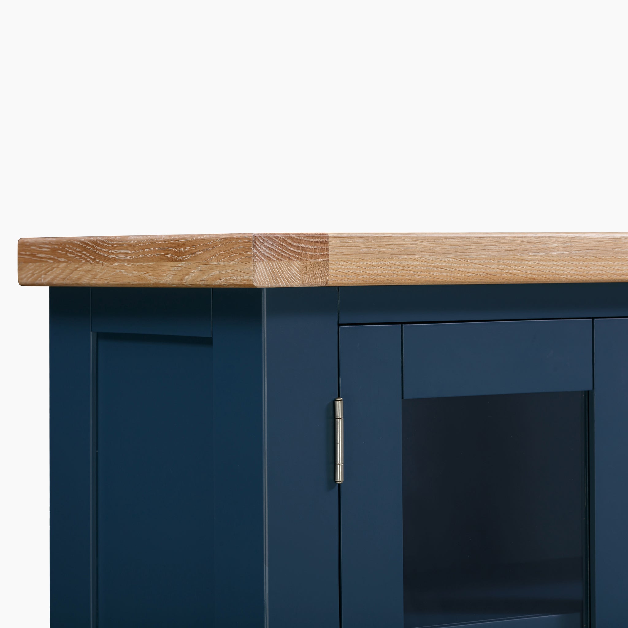 The Burford Display Cabinet in Navy Blue showcases a navy blue finish complemented by a natural oak countertop, all set against a crisp white background.