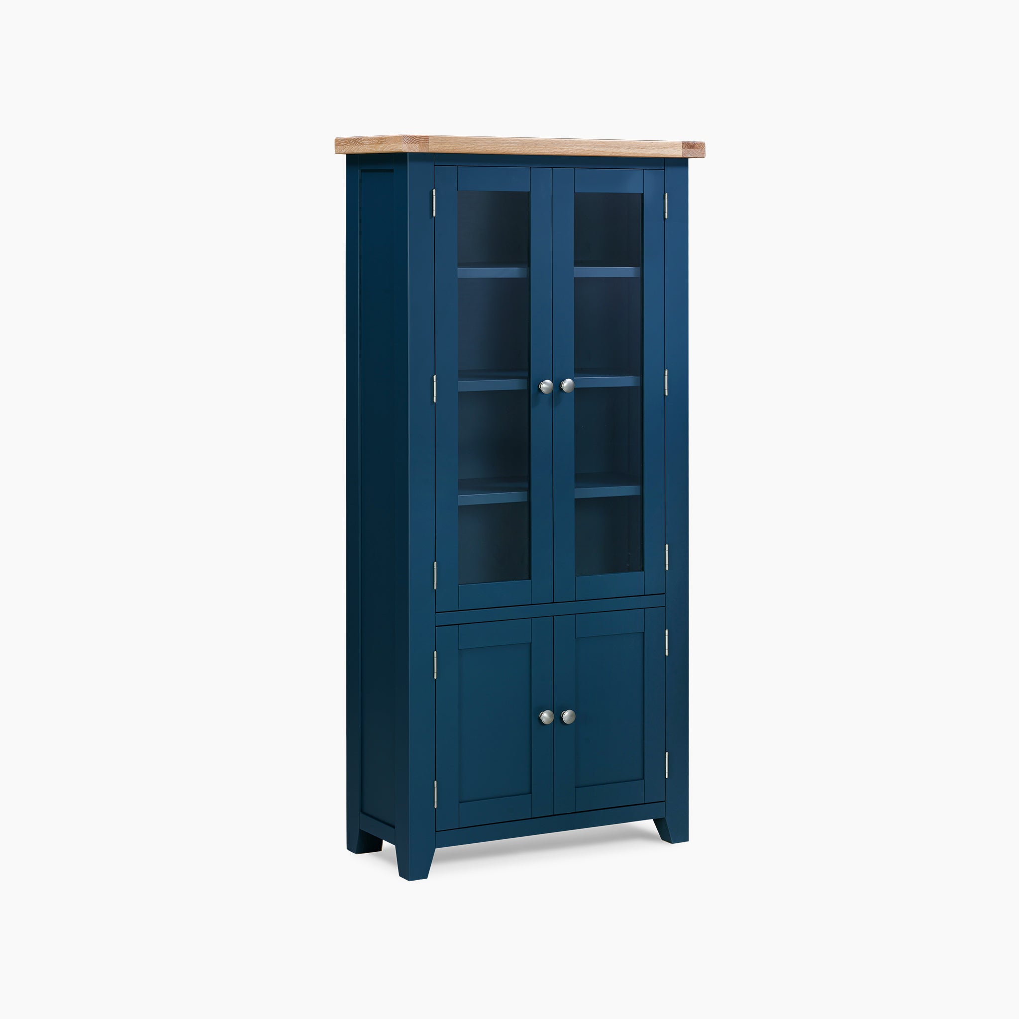 Introducing the Burford Display Cabinet in Navy Blue: a tall cabinet with glass doors and a natural oak top. It boasts spacious shelves and two lower solid doors with knobs, providing an elegant way to display your favorite items.