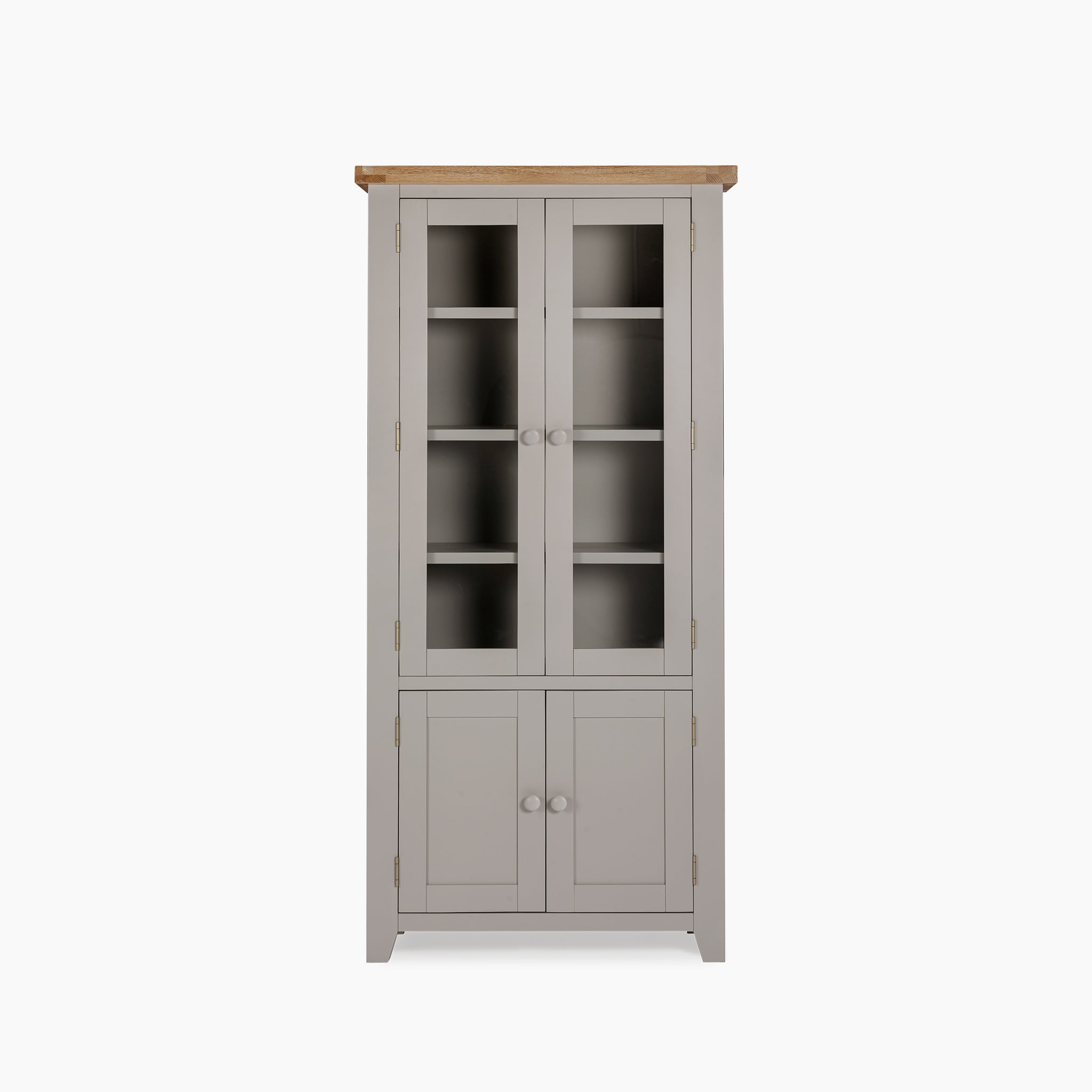 The Burford Display Cabinet in Pebble Grey features glass-panelled upper doors and a natural oak wooden top, effortlessly blending open shelves with lower closed compartments for versatile storage.