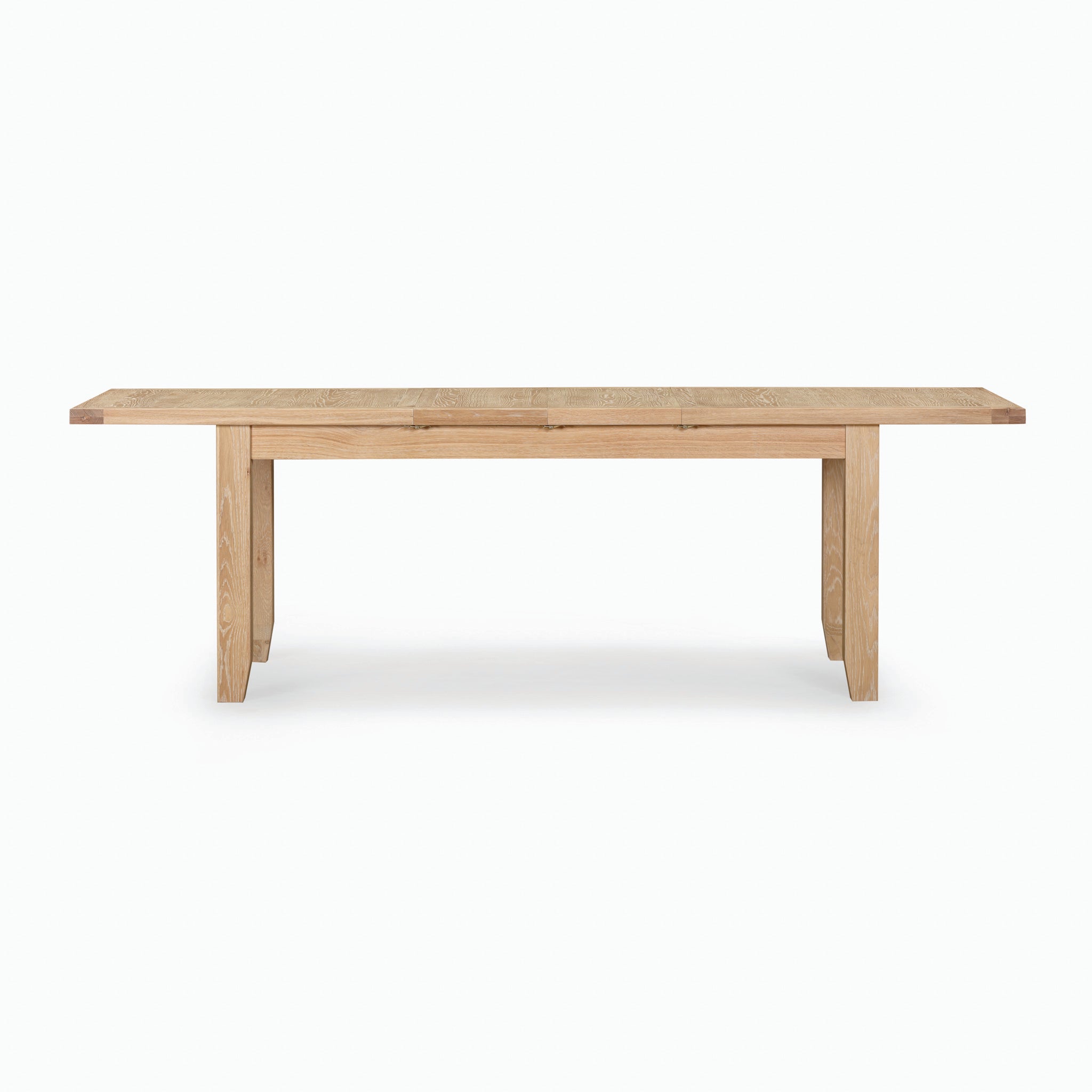 A minimalistic Burford 6-10 Seater Extending Dining Table in Natural Oak with a simple design, perfect for any dining space, displayed on a white background.