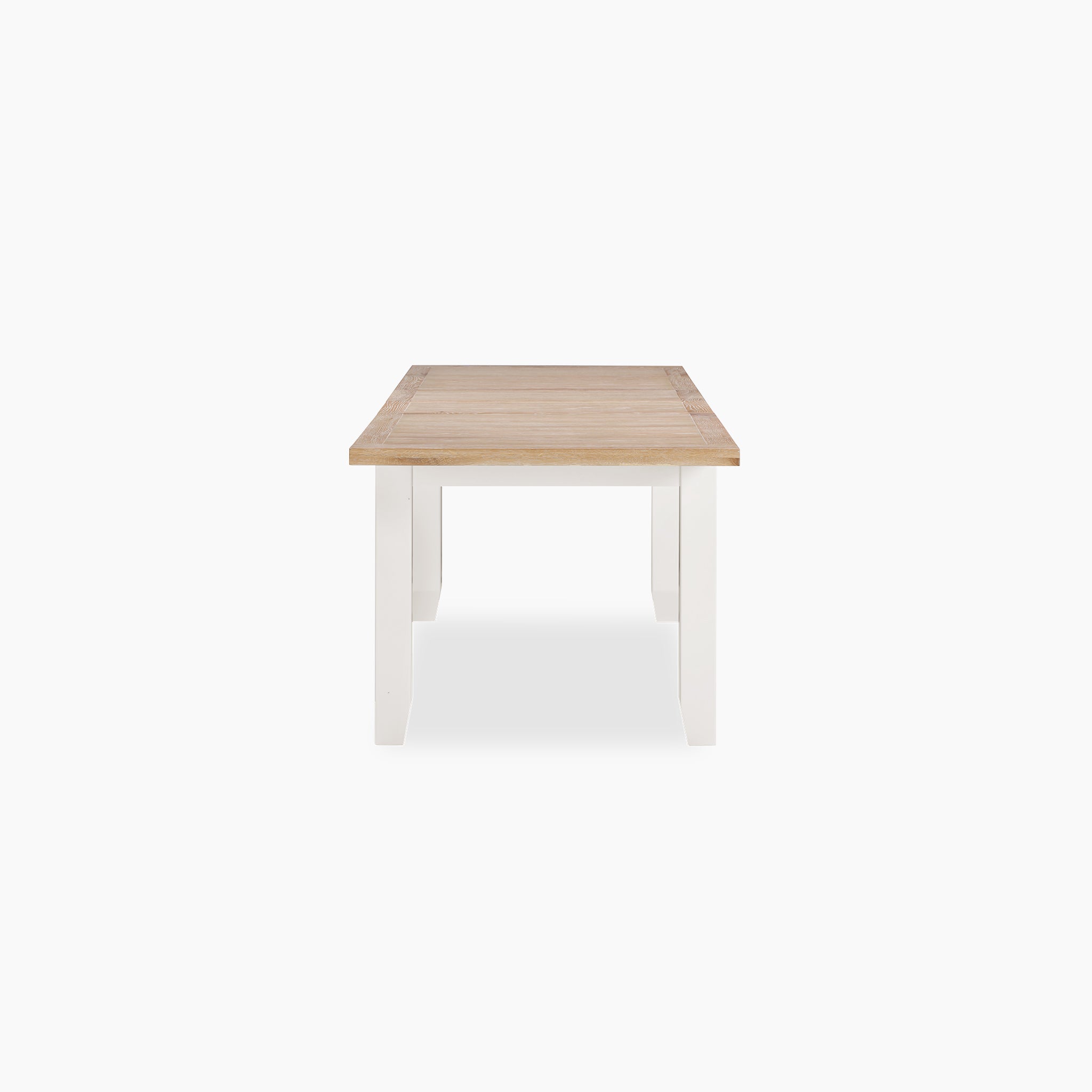 Front view of the Burford 6-10 Seater Extending Dining Table in Warm White, featuring a natural oak light brown tabletop and white legs, highlighting premium craftsmanship on a plain background.