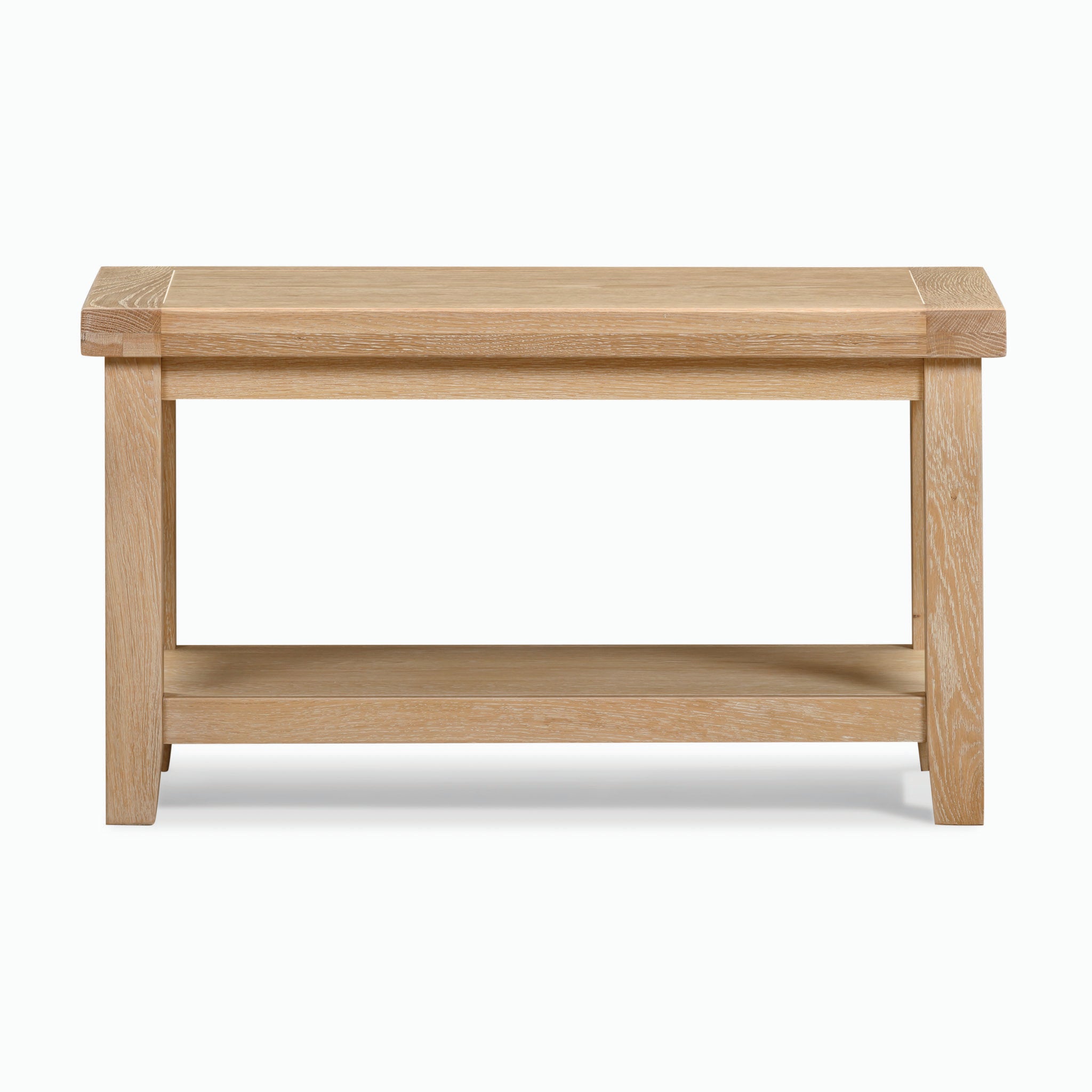 A large, rectangular Burford coffee table with a lower shelf in natural oak and featuring a whitewash finish, set against a plain white background.