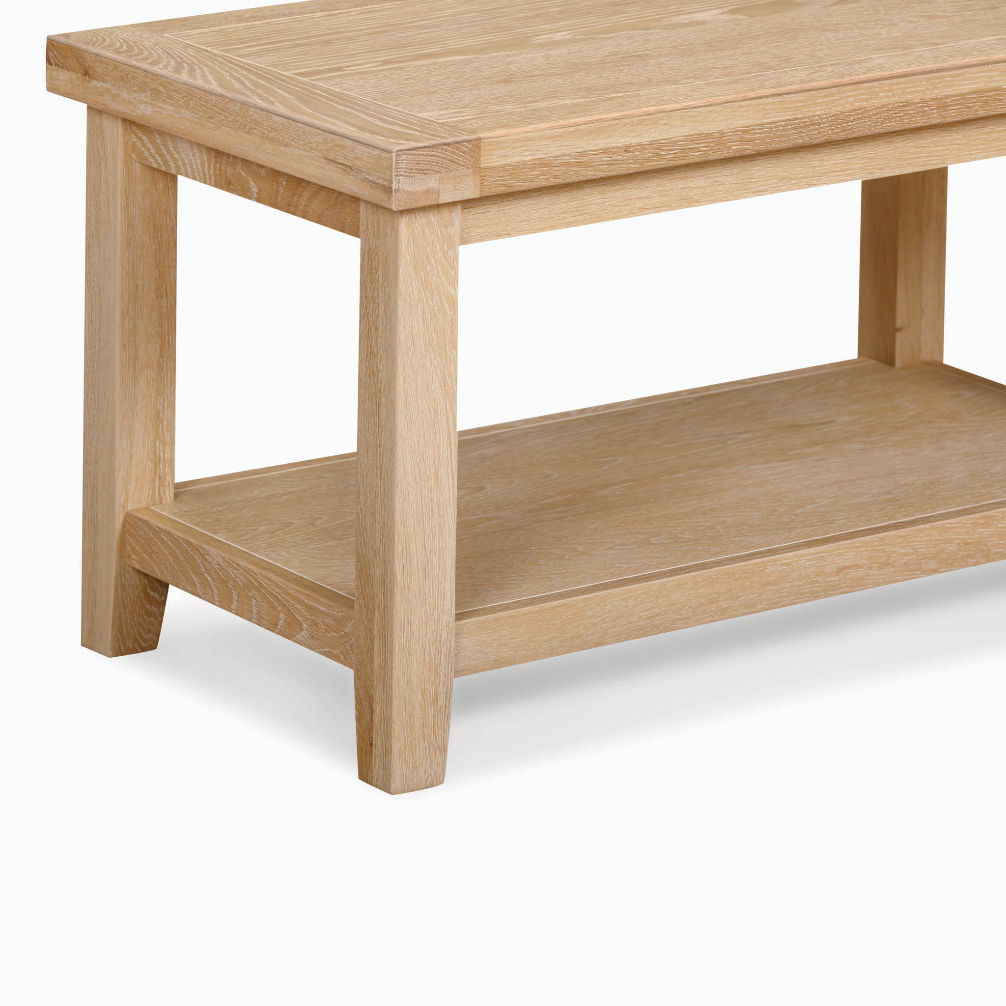 The Burford Large Coffee Table with Shelf in Natural Oak, featuring a light wood design and a lower shelf, is showcased against a plain white background.